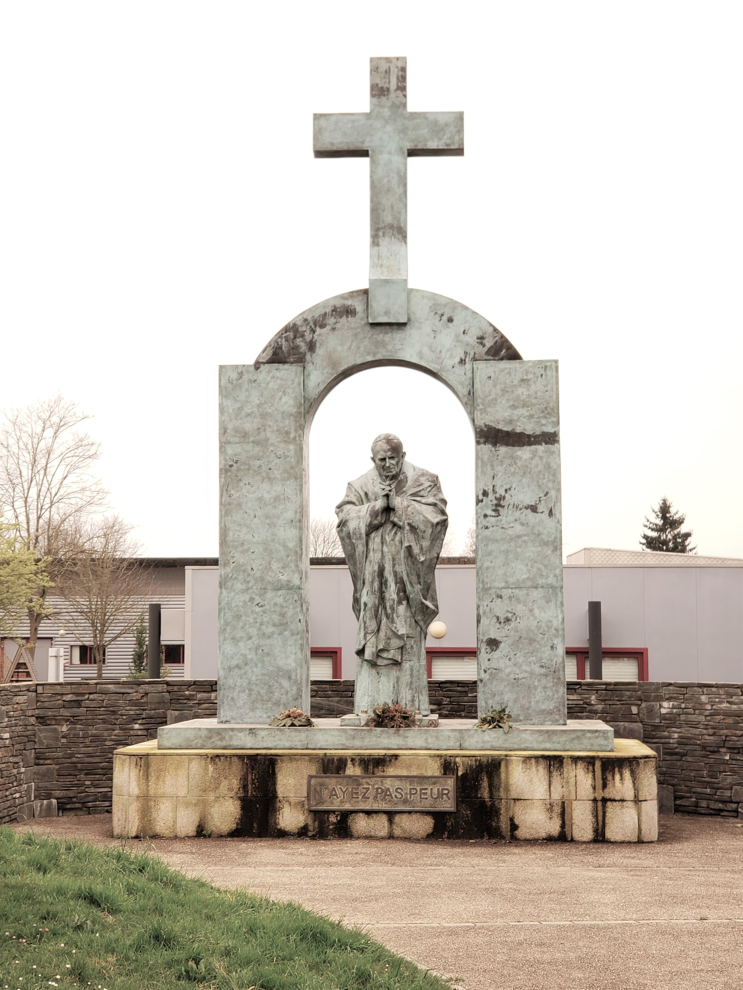 The controversial statue of Pope John Paul II in Ploërmel, France, moved in 2018 from a public town square to privately owned land after a French court ruled it violated the country's 100-year-old law separating church and state.