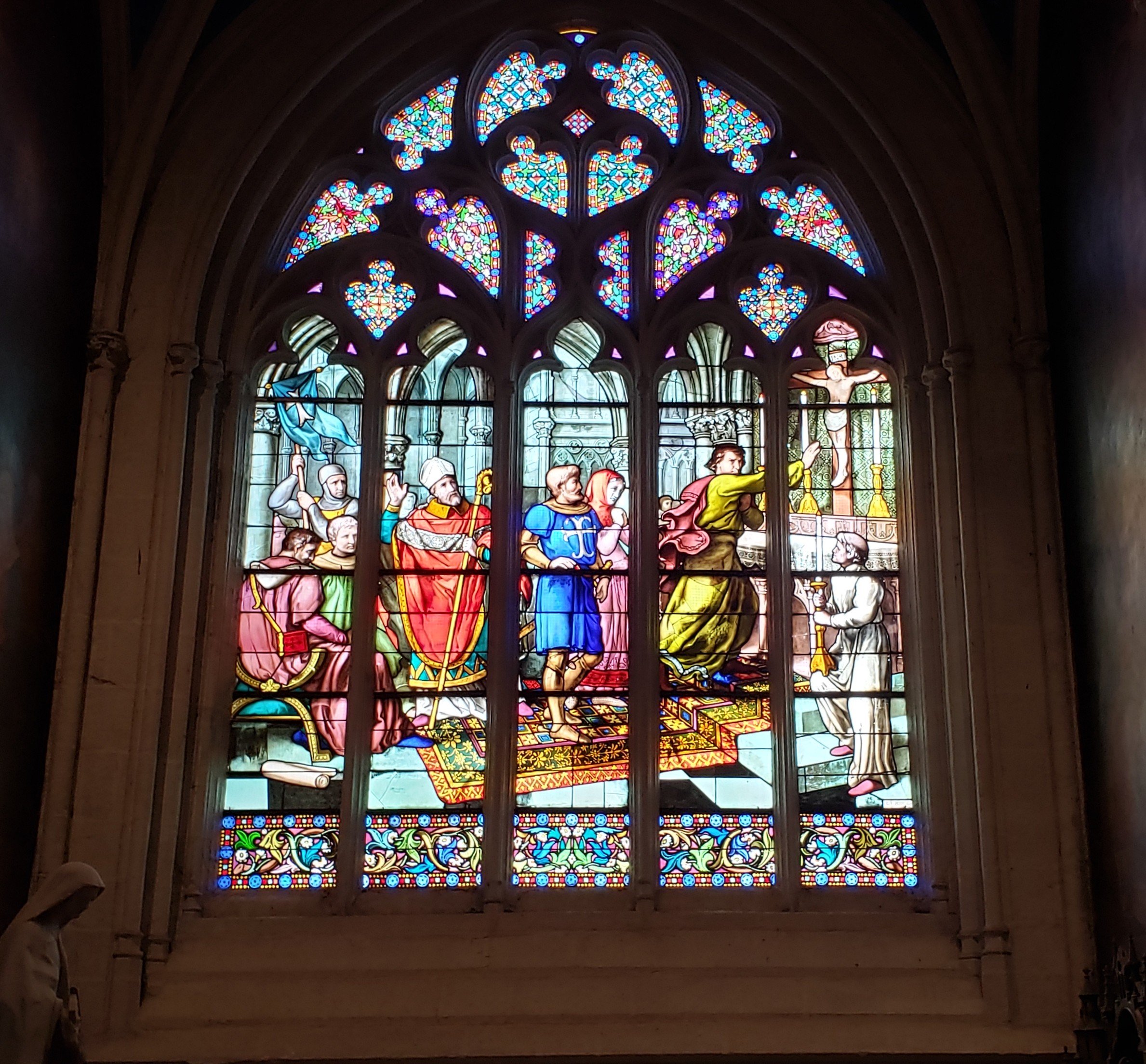 The magnificent stained glass windows inside the Saint Corentin Cathedral in Quimper, France, one of the finest examples of gothic religious architecture and craftsmanship in all of Brittany.