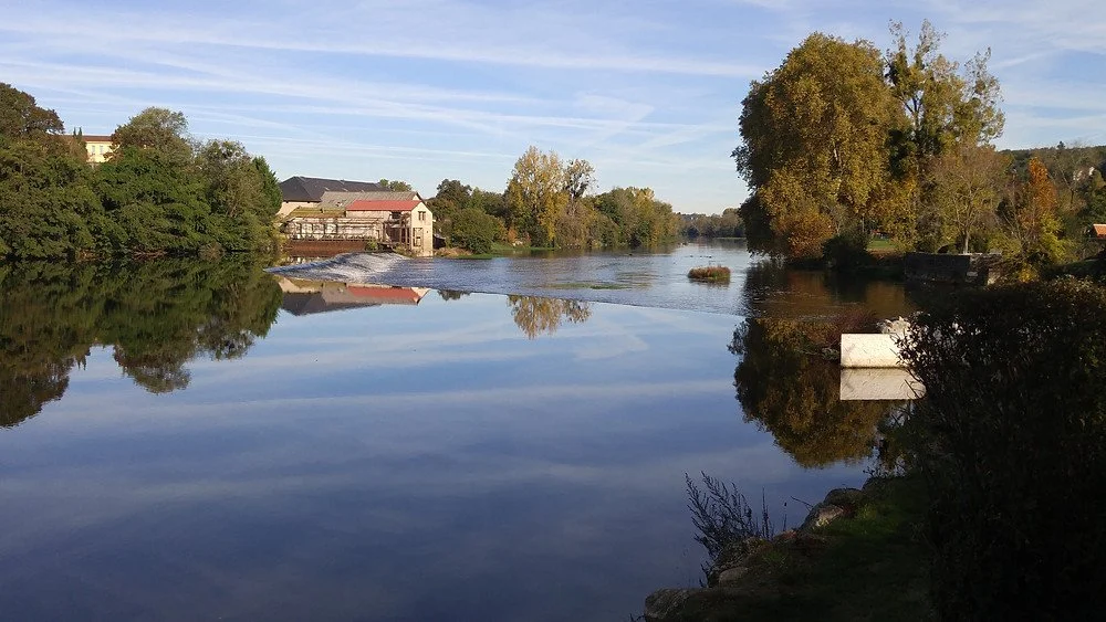The gentle, river-wide falls on the Vienne River at Confolens, France, where the river glides at a serene pace through the heart of this small town of 2,700.
