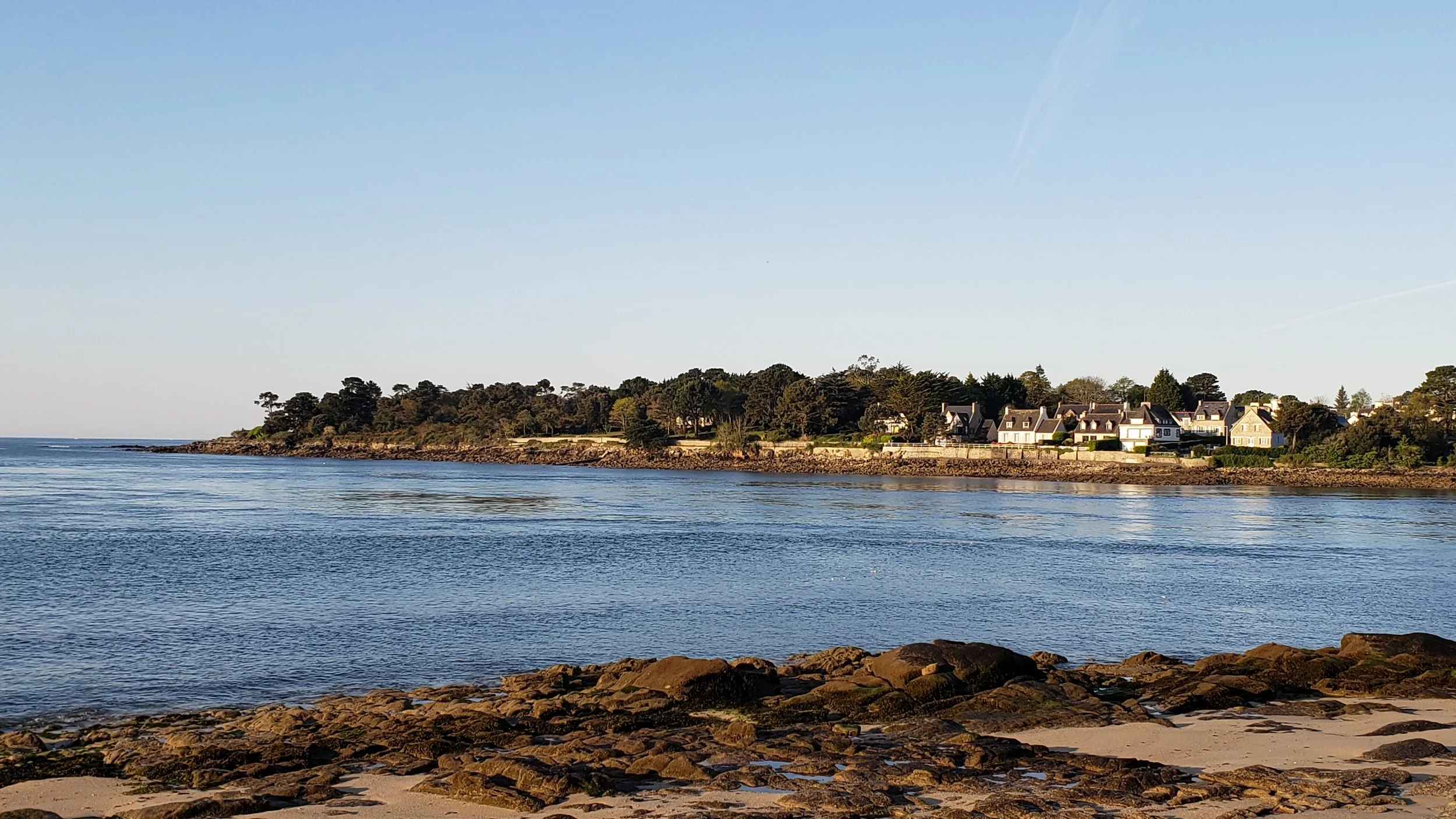 Golden hour light over the mouth of the Odet River as seen from the beach at Bénodet, France