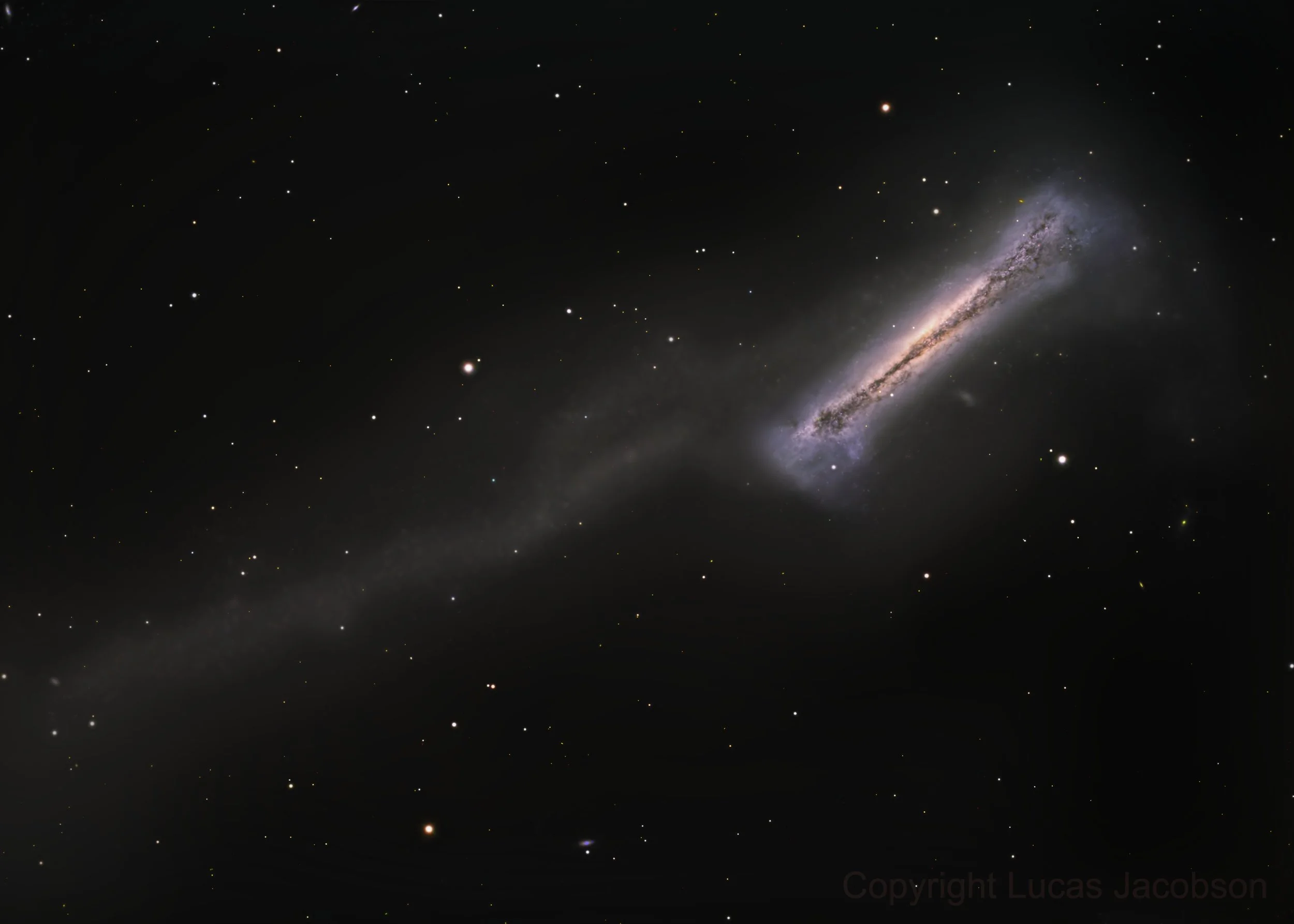An image of deep space featuring the Andromeda galaxy with numerous stars surrounding it.