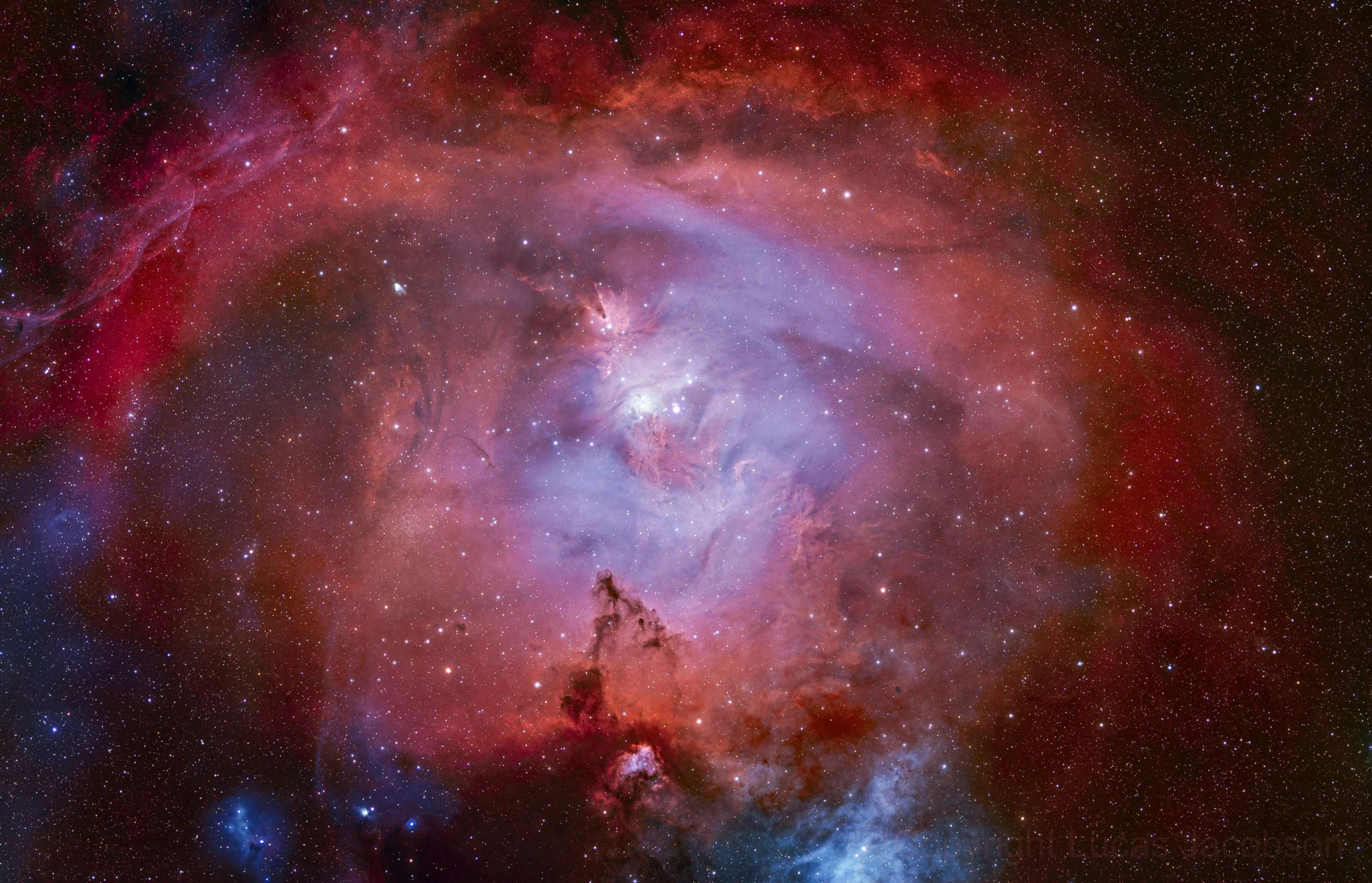A colorful image of space with stars, nebulae, and cosmic dust.