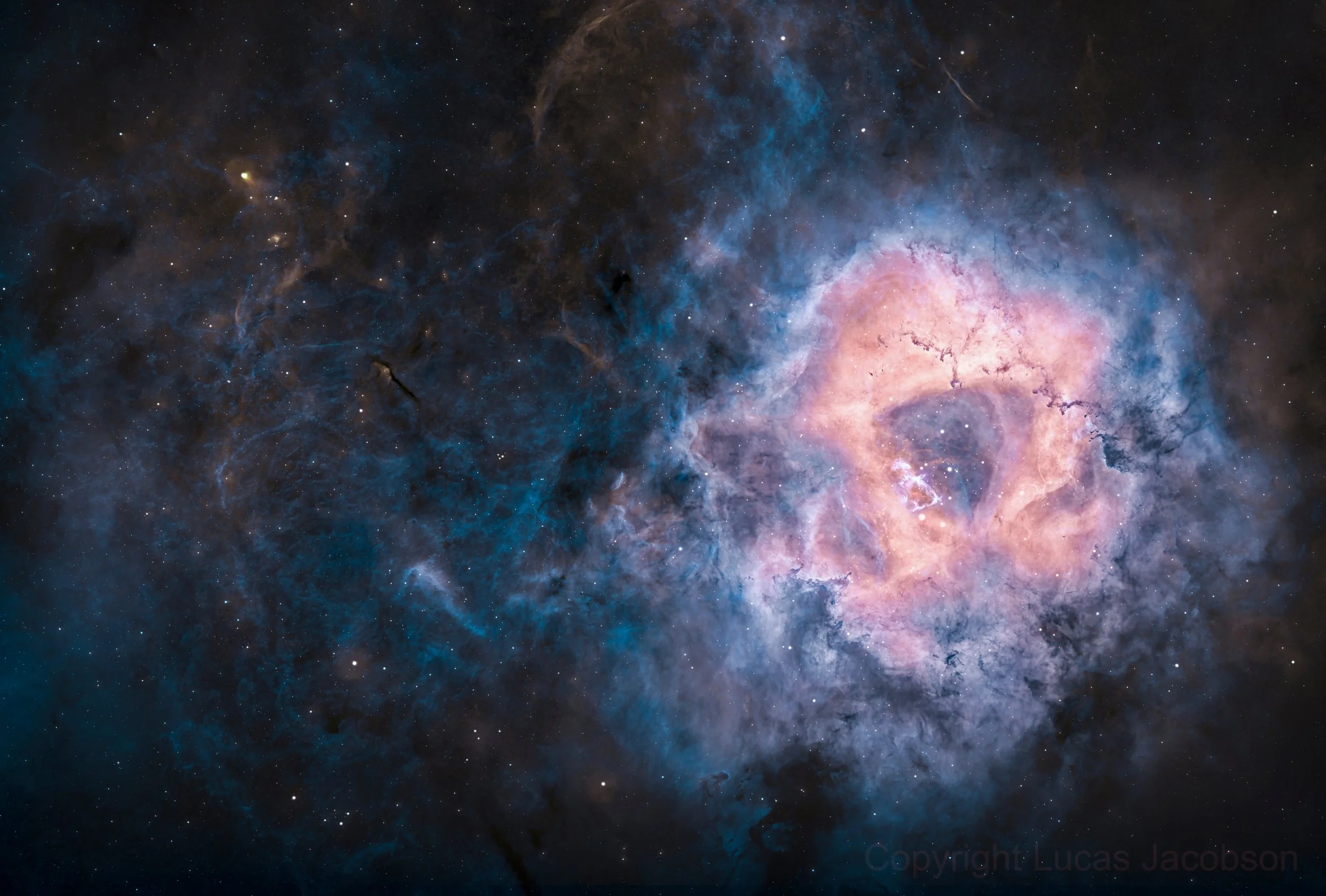 A detailed image of a colorful galaxy in space with bright stars and cosmic clouds of blue, pink, and orange hues.