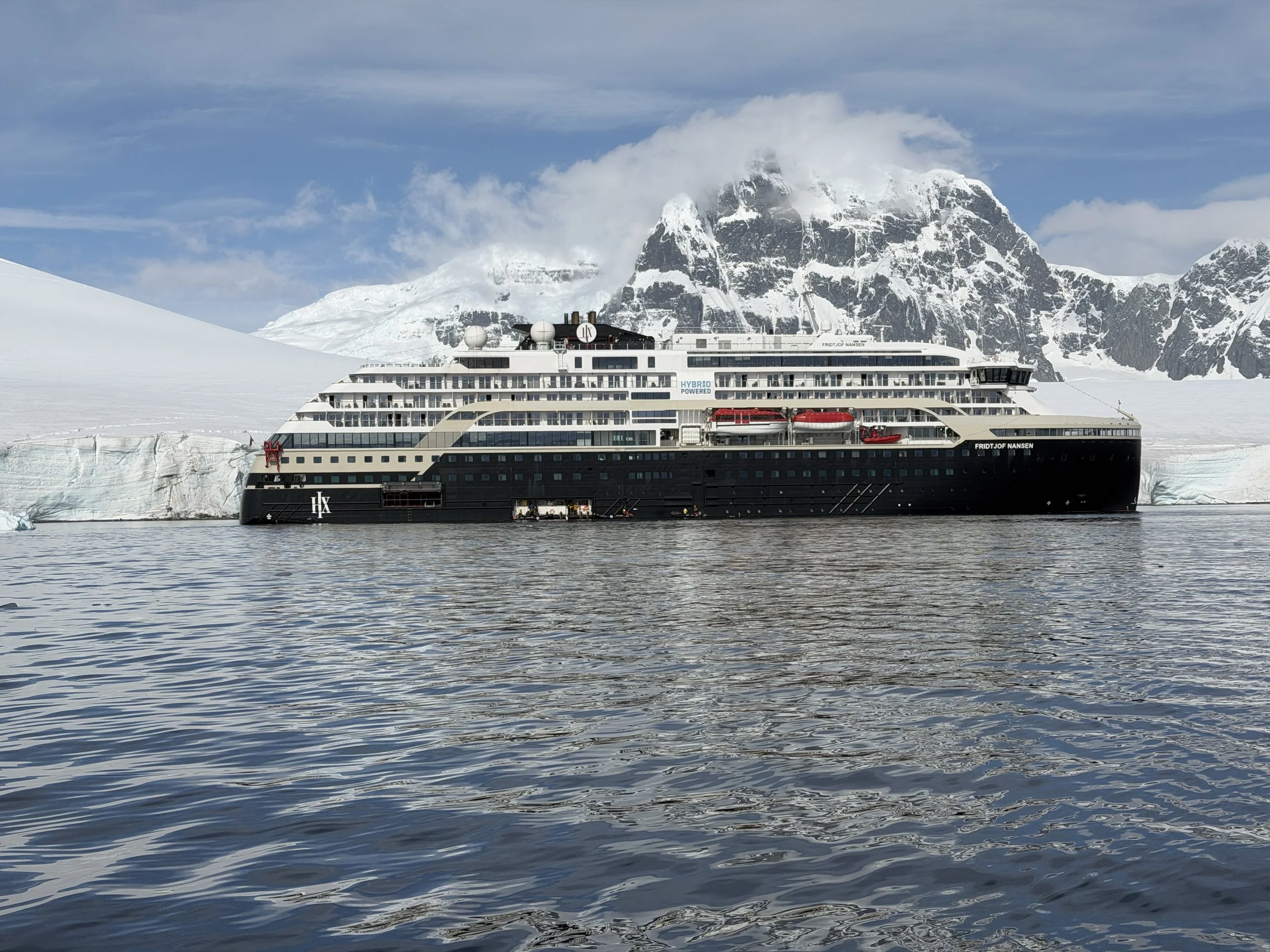  HX expedition ship surrounded by Antarctic scenery 