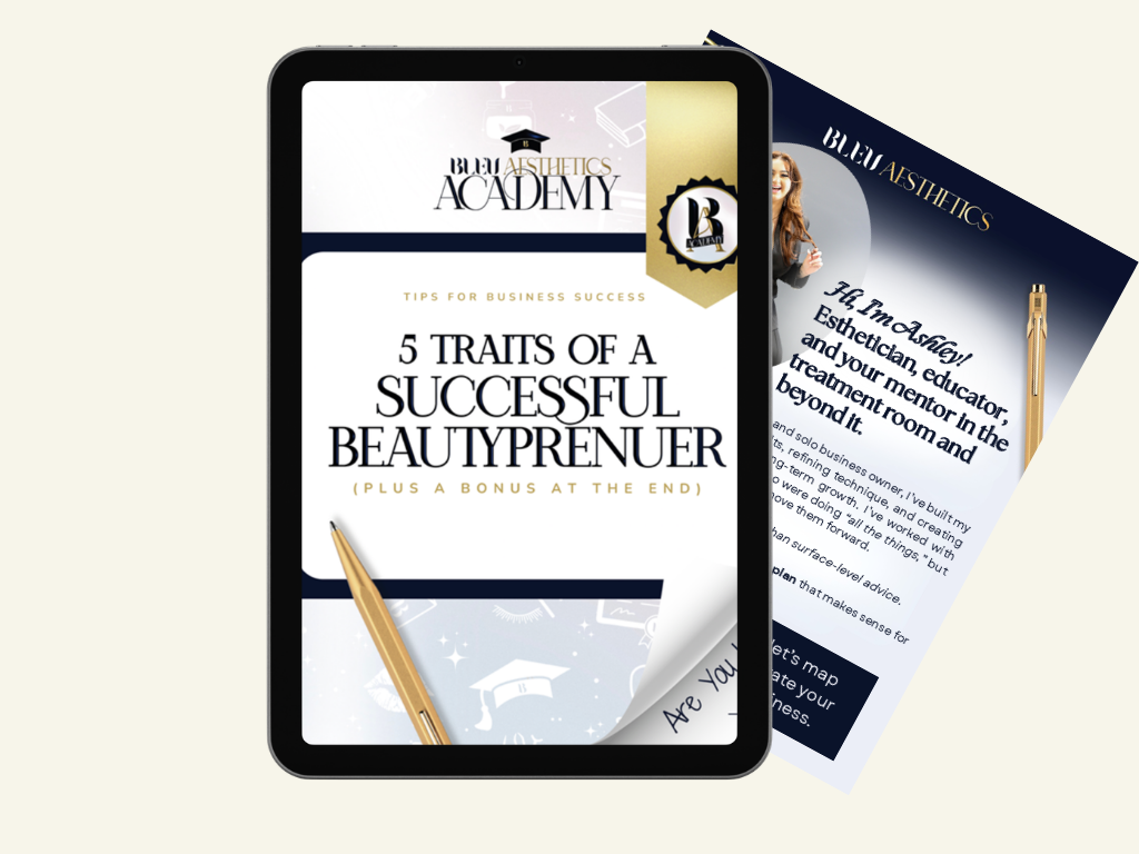 Digital device displaying a booklet titled "5 Traits of a Successful Beautypreneur" from Bleu Aesthetics Academy, with a second booklet partially visible behind it.
