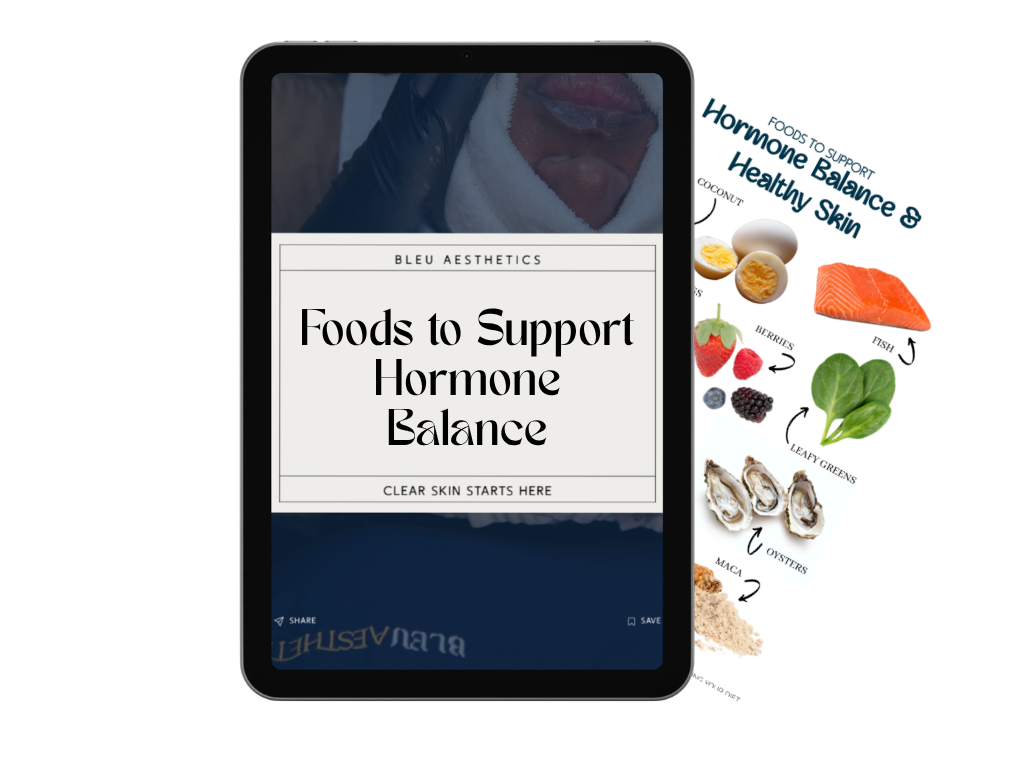 A tablet displaying a digital cover titled "Foods to Support Hormone Balance." Behind the tablet, there is a printed pamphlet or page with the same title, featuring images of foods such as eggs, salmon, berries, leafy greens, oysters, and maca powder, illustrating foods that support hormone balance and healthy skin.