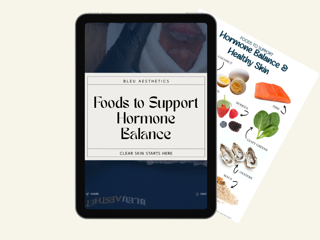 A tablet displaying a guide titled 'Foods to Support Hormone Balance' with a background image of a person's face. Behind the tablet, a page shows various foods like eggs, berries, fish, leafy greens, oysters, and maca powder that support hormone balance and healthy skin.