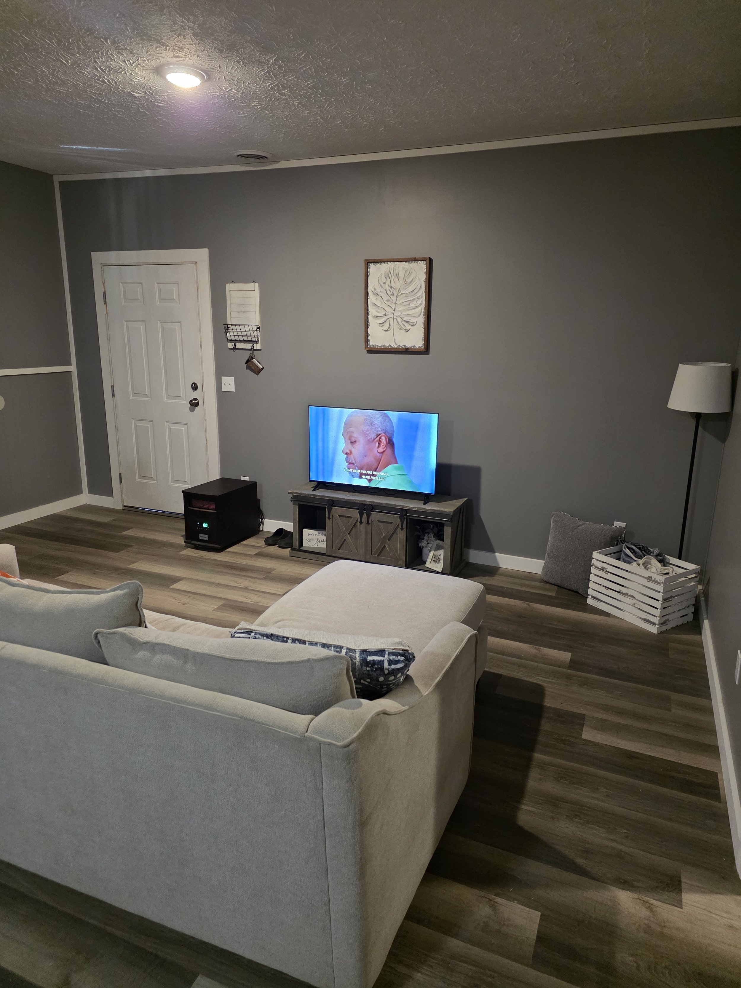 large living room and kitchen area stove and microwave, fridge and large counter space for cooking