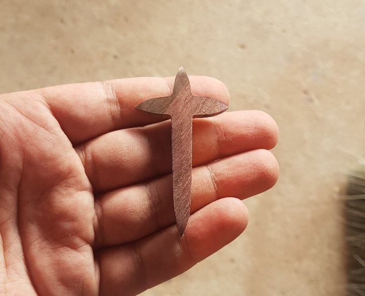 pointy ends elongated neck cross.jpeg