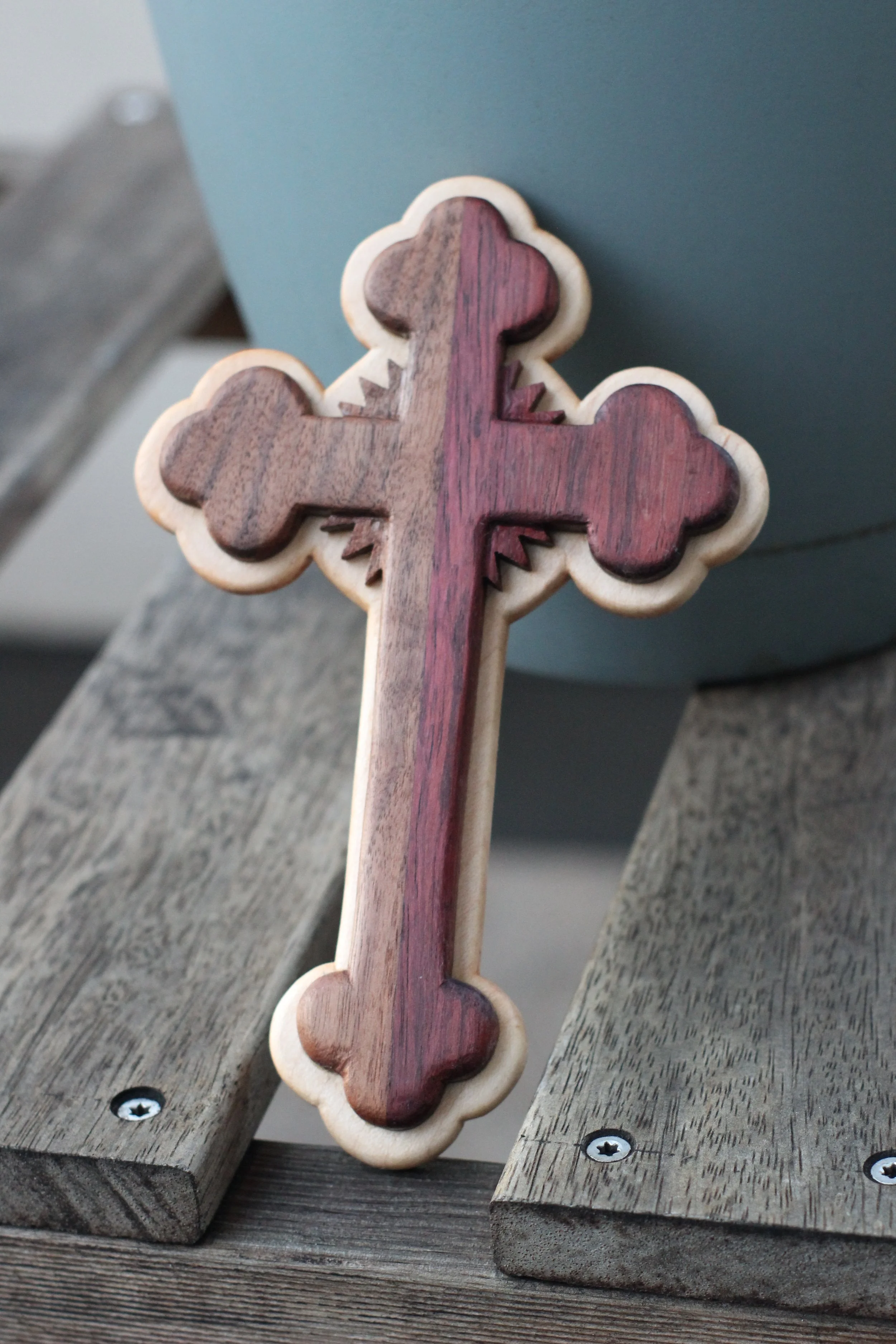 angled shot Daniel the lion rock maple purple heart black walnut 3 toned cross wall rays coptic rounded ends hanging.JPG