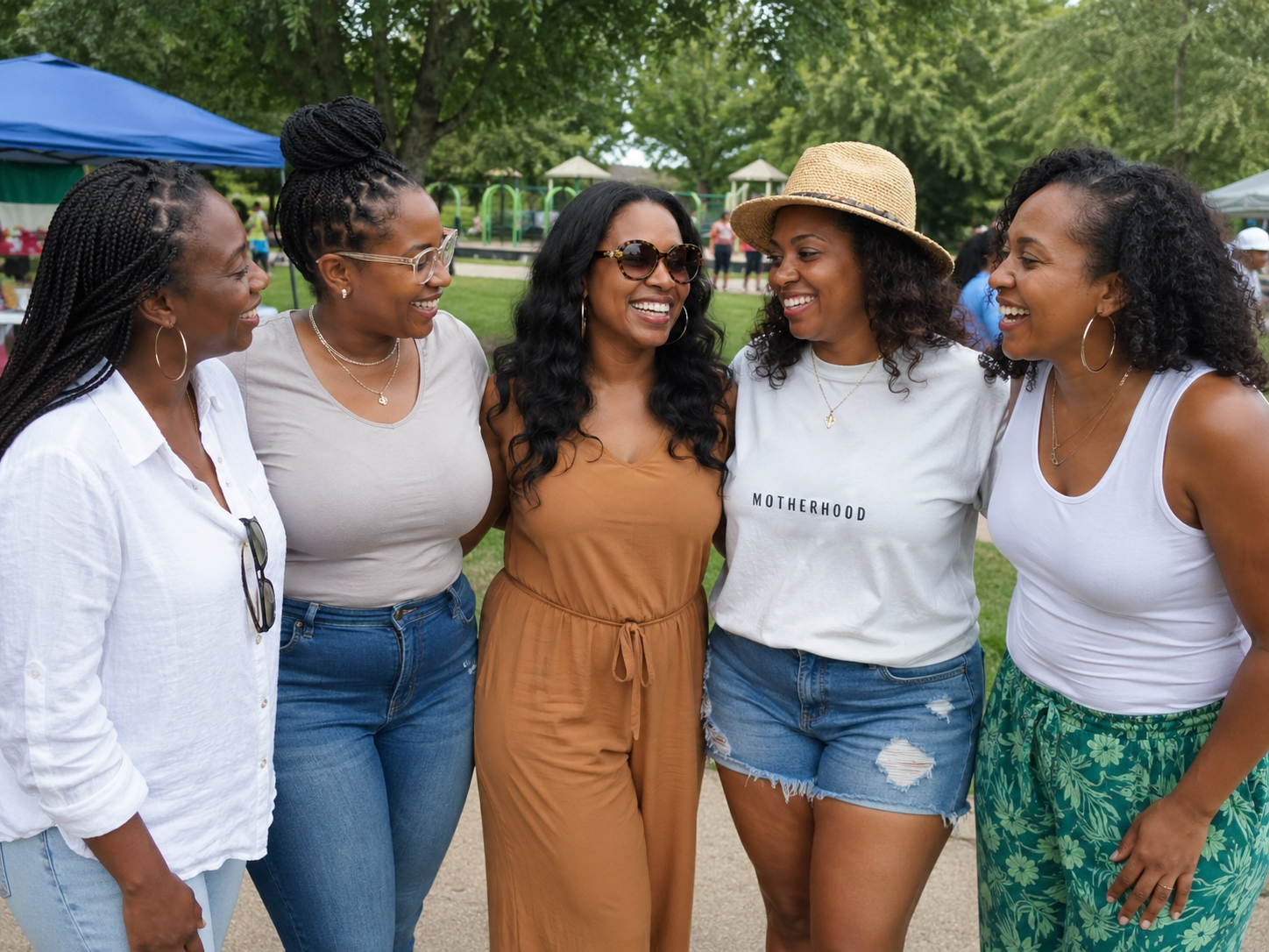 5 african american lactation supporters gathered at an event in a park during the summer