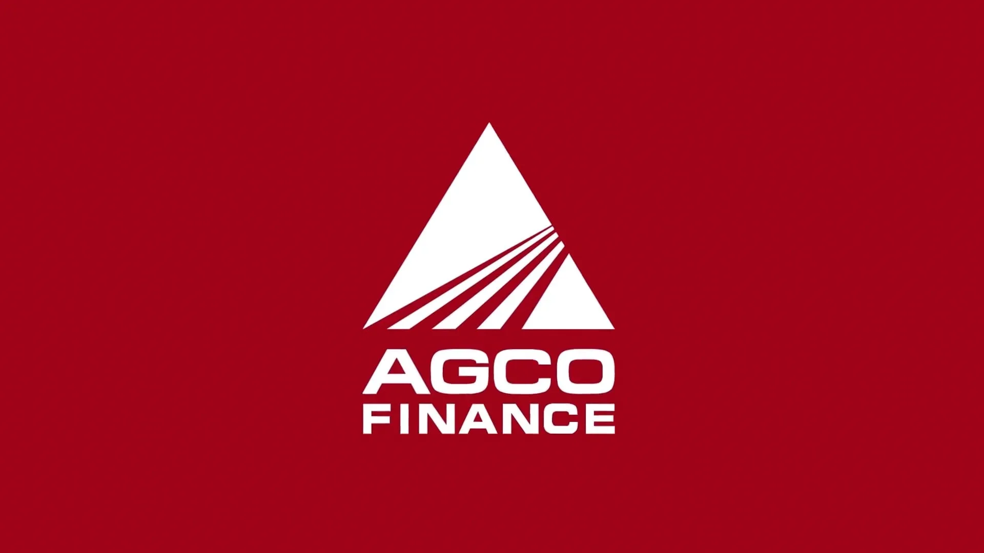 Logo de la société Agco Finance avec un fond rouge, un symbole triangulaire et des lignes diagonales à l'intérieur du triangle, professionnel du financement AGCO et des tracteurs VALTRA