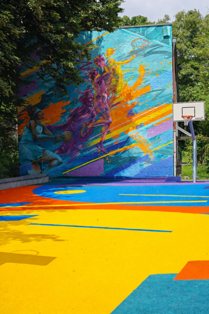 Vibrant basketball court in the sunshine.png