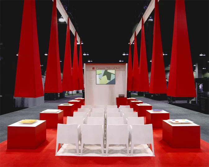 The structure reminds one of the simplicity and elegance of a roman temple enhanced by a very Italian red.