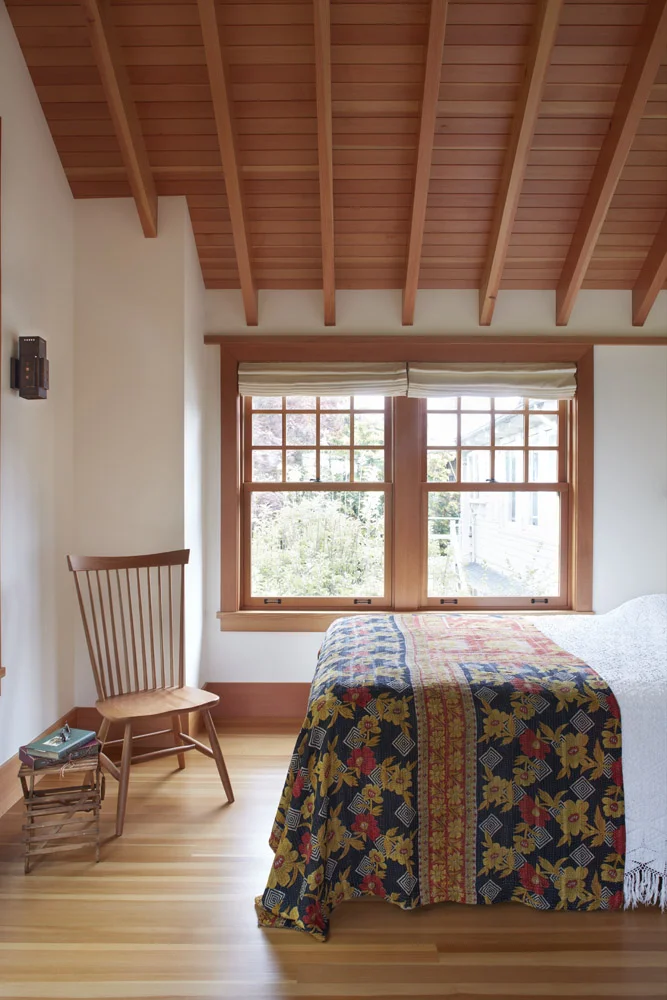  Vaulted doug fir ceiling with custom built copper sconces with natural patina. Antique indian sari bed spread.&nbsp; 