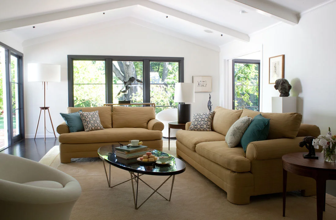 The living room harbors an impressive art collection. We designed the lighting to feature the pieces.  Photography: Leslie Williamson (Copy)