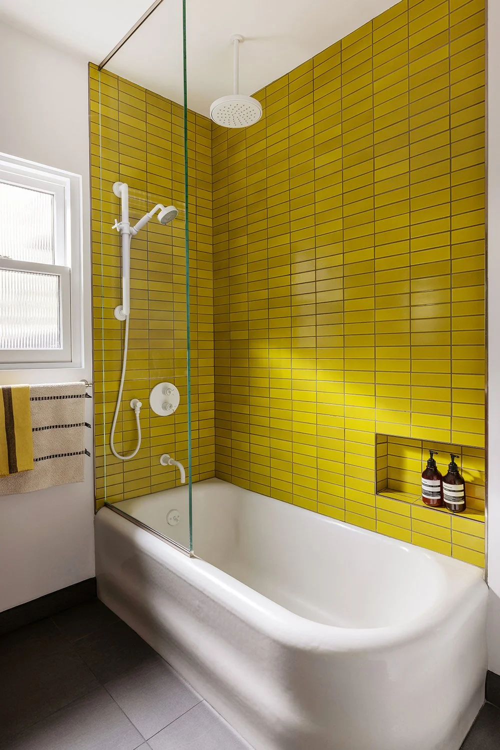 Wabi sabi bathroom with Chartreuse yellow tiles