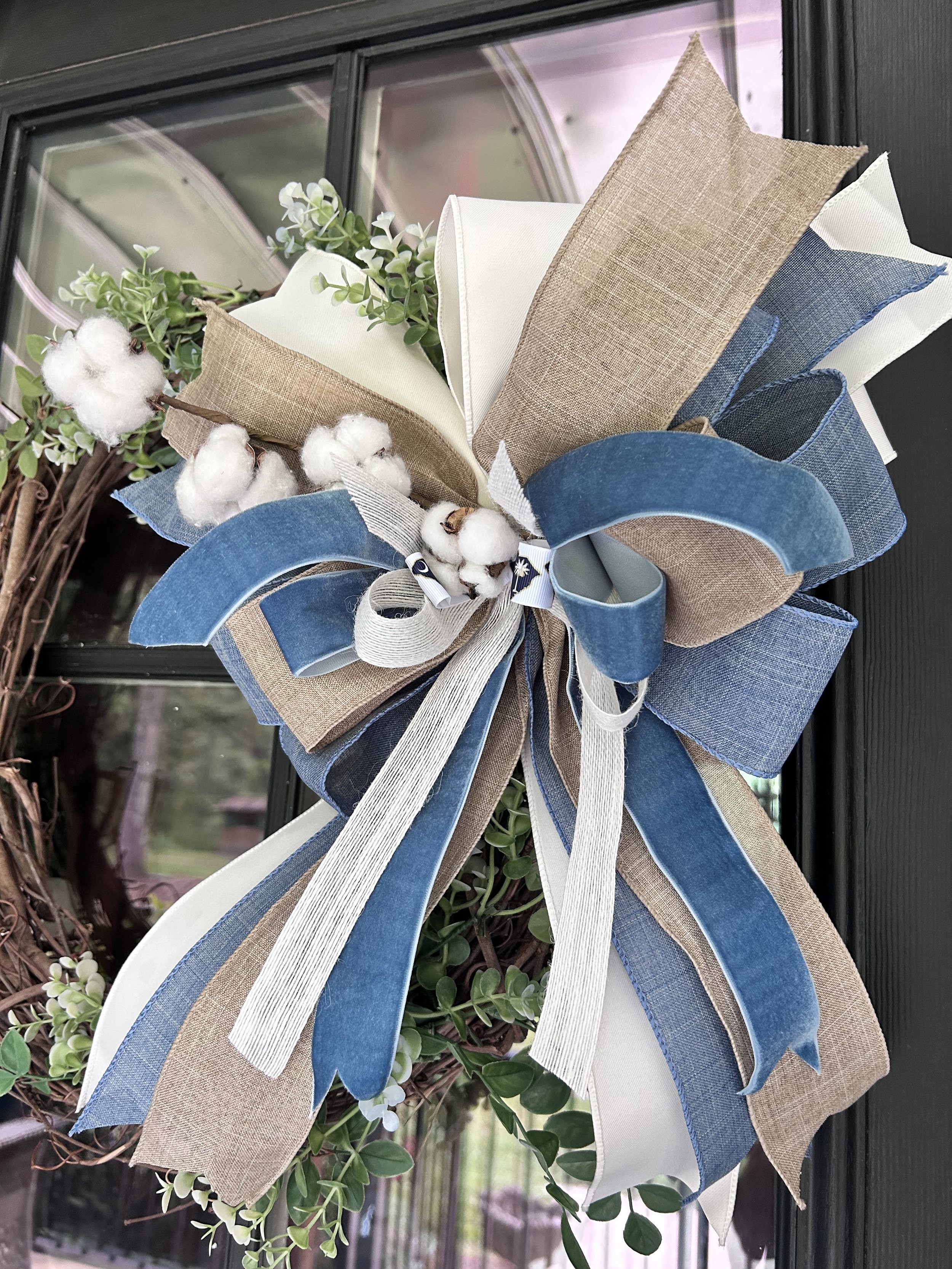 Blue Ridge Carolina Cotton Bow with denim blue velvet, ivory and natural linen ribbon with cotton accents on a grapevine wreath