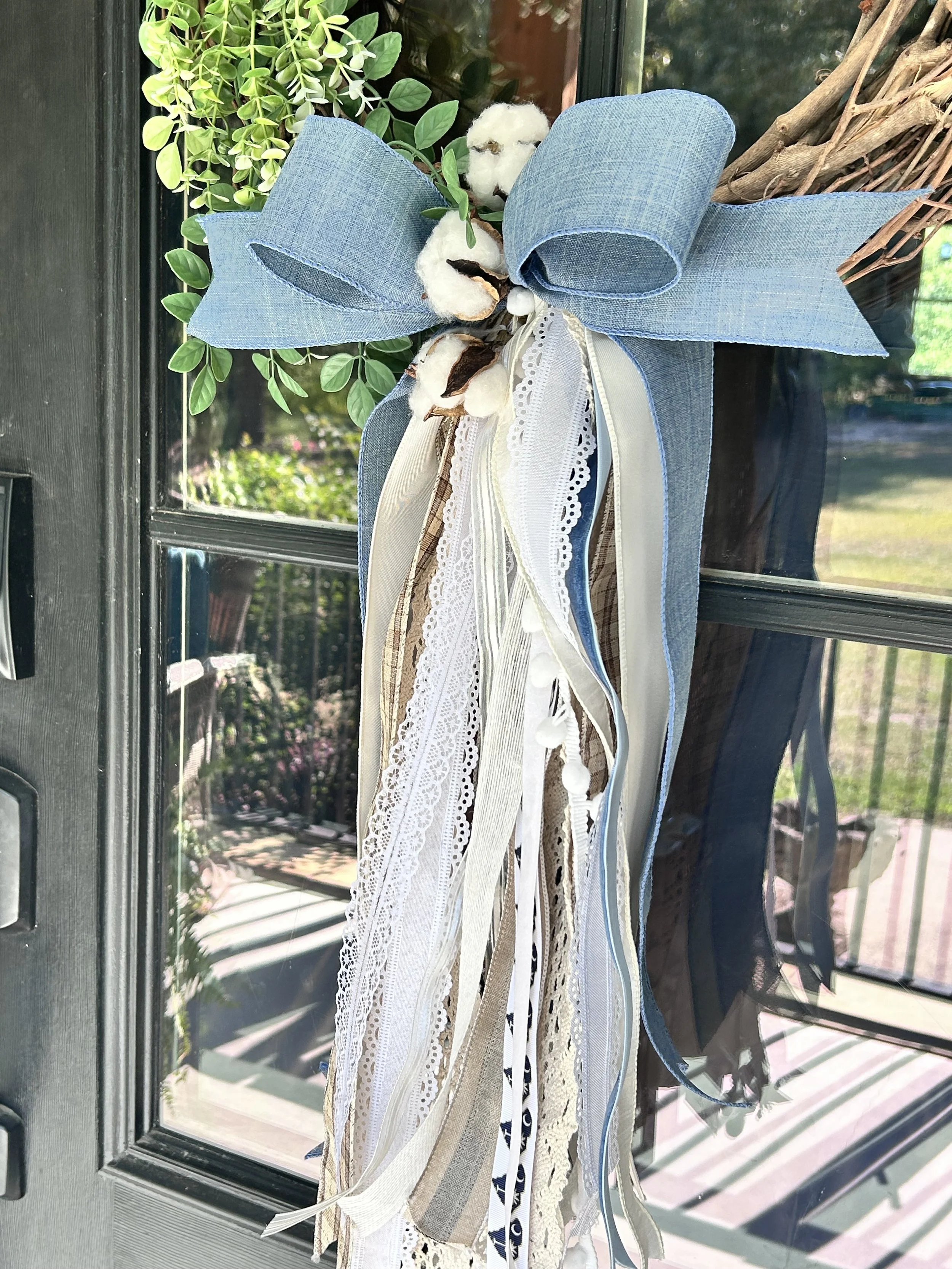 Handcrafted Southern Cascade Blue Belle bow with soft blue ribbon, lace, natural ribbon and cotton accents