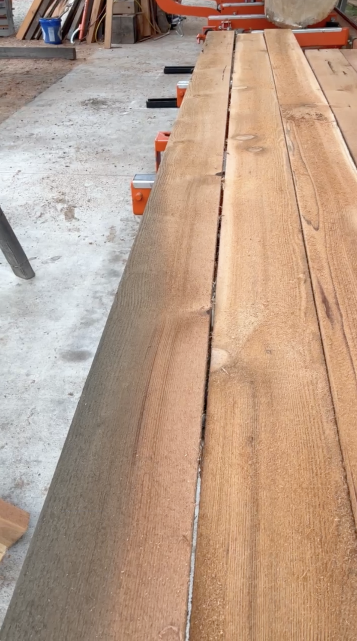 Board from cedar float logs, showing staining from steel bolts
