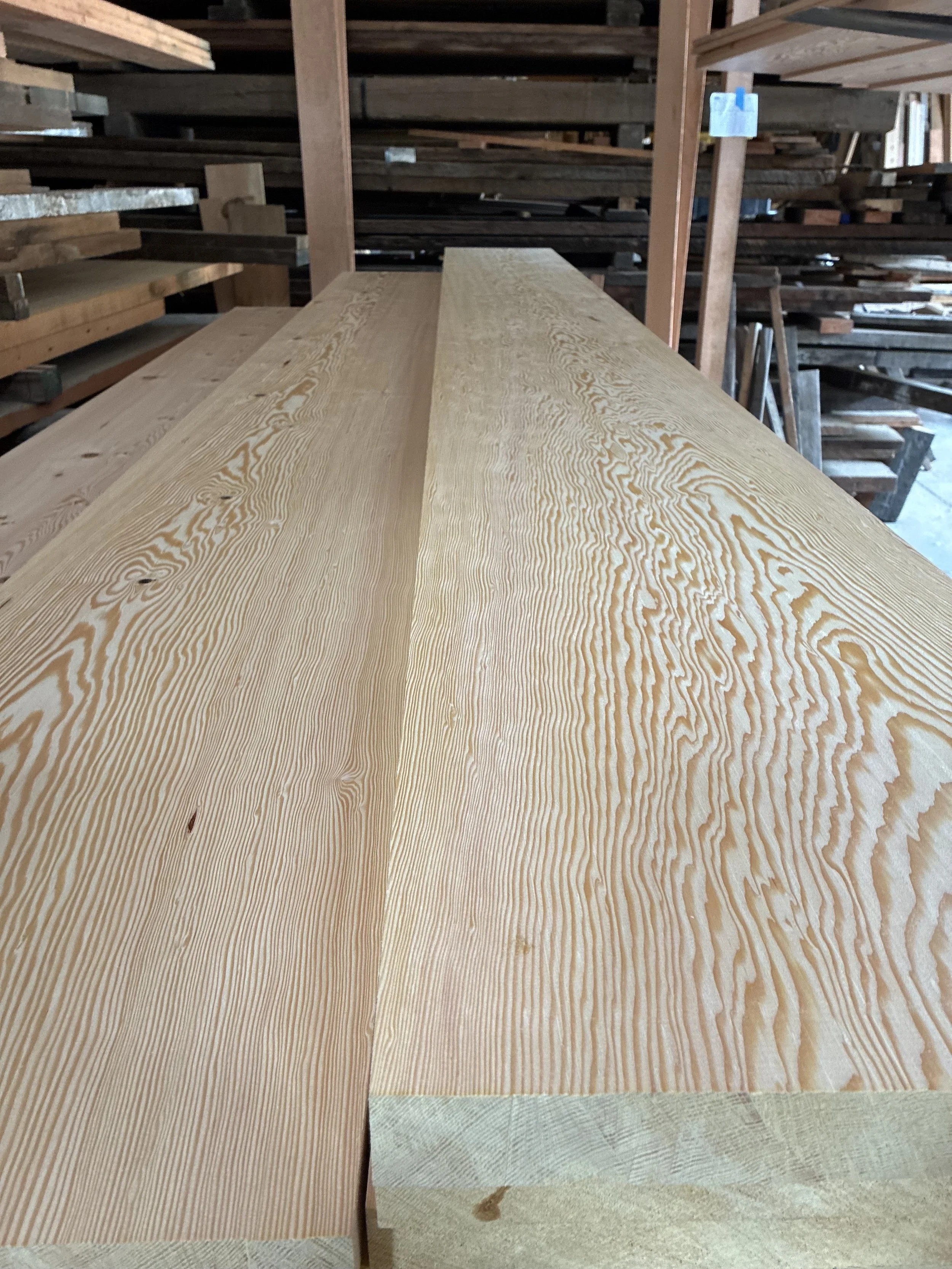 Surfaced wide-plank shelving boards