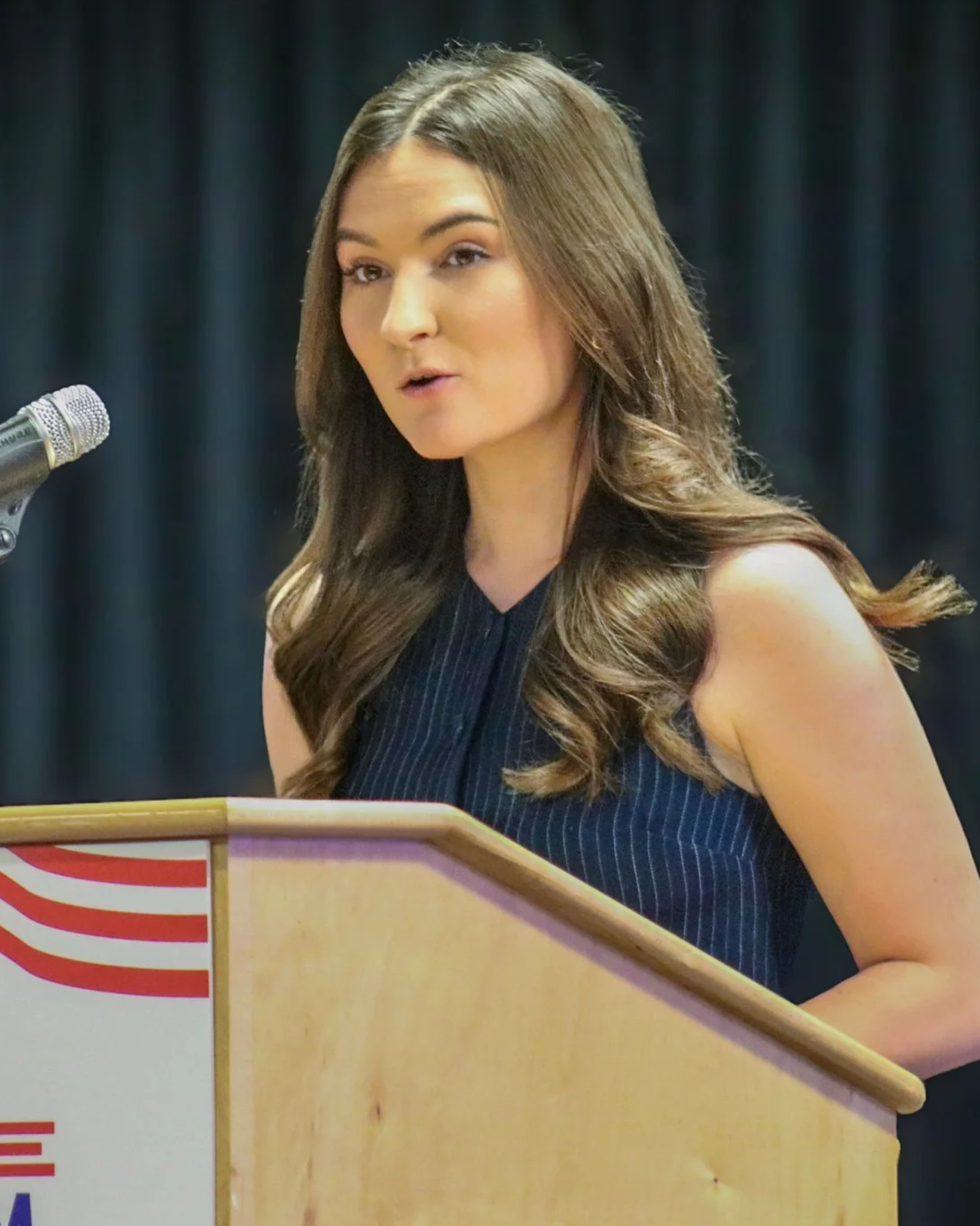 Danielle Franz speaking at a podium