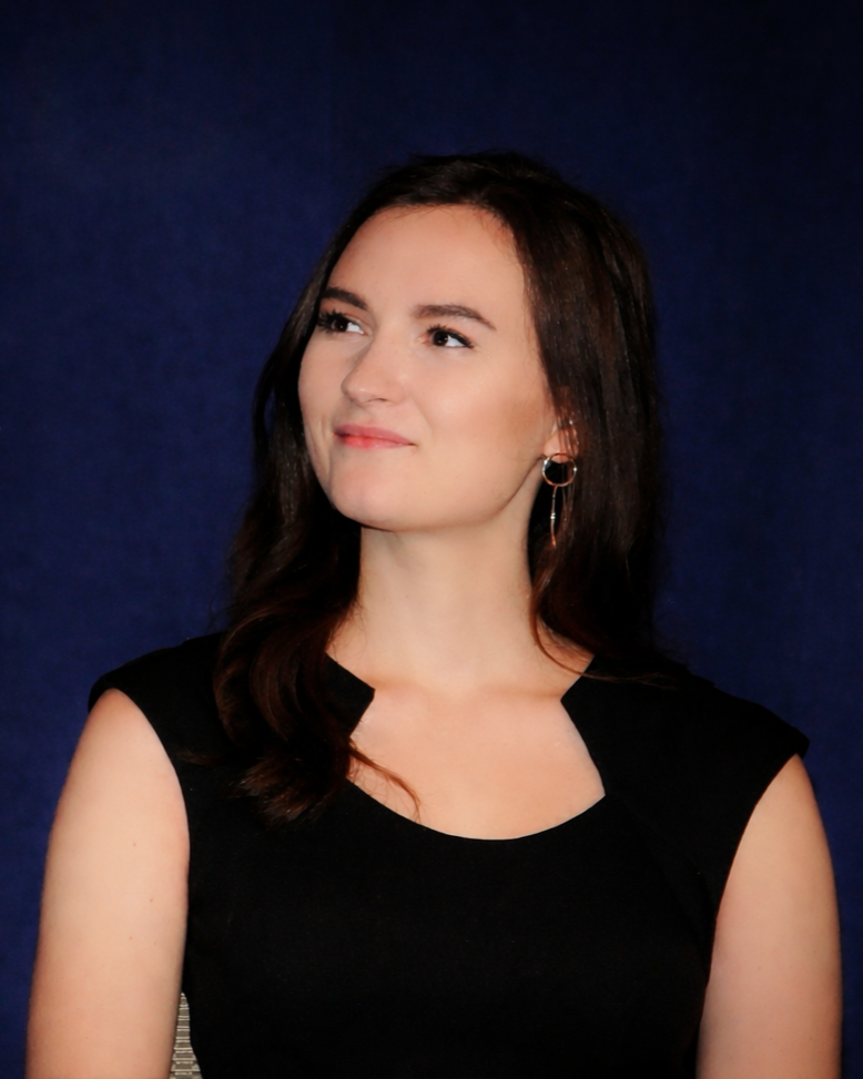 Danielle Franz, headshot on navy background