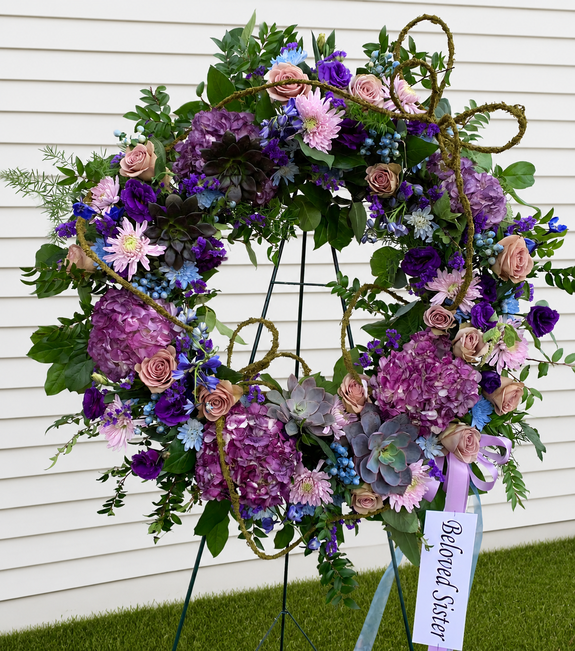wreath symathy purple pink funeral flowers.png