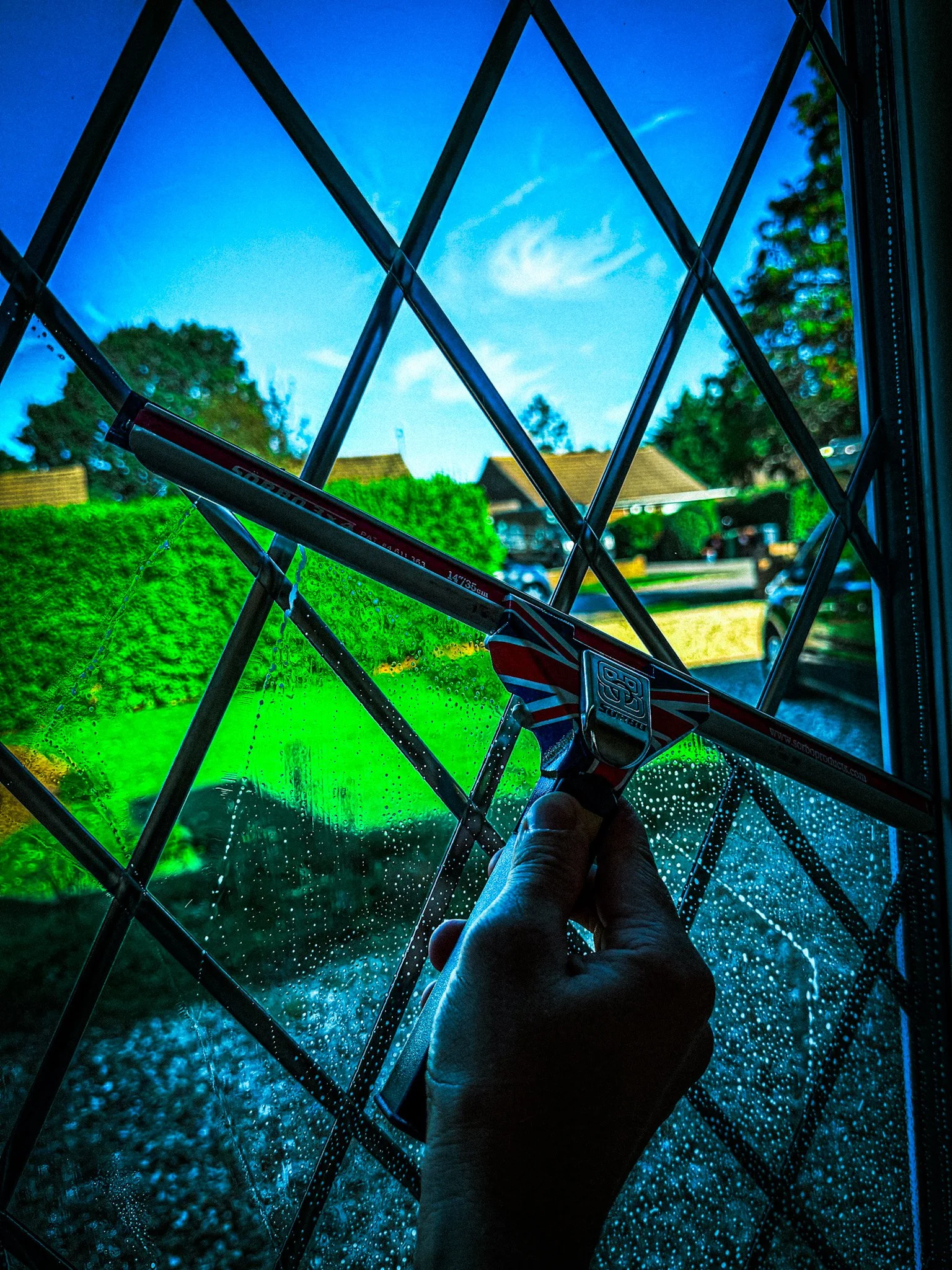 window cleaner using squeegee 