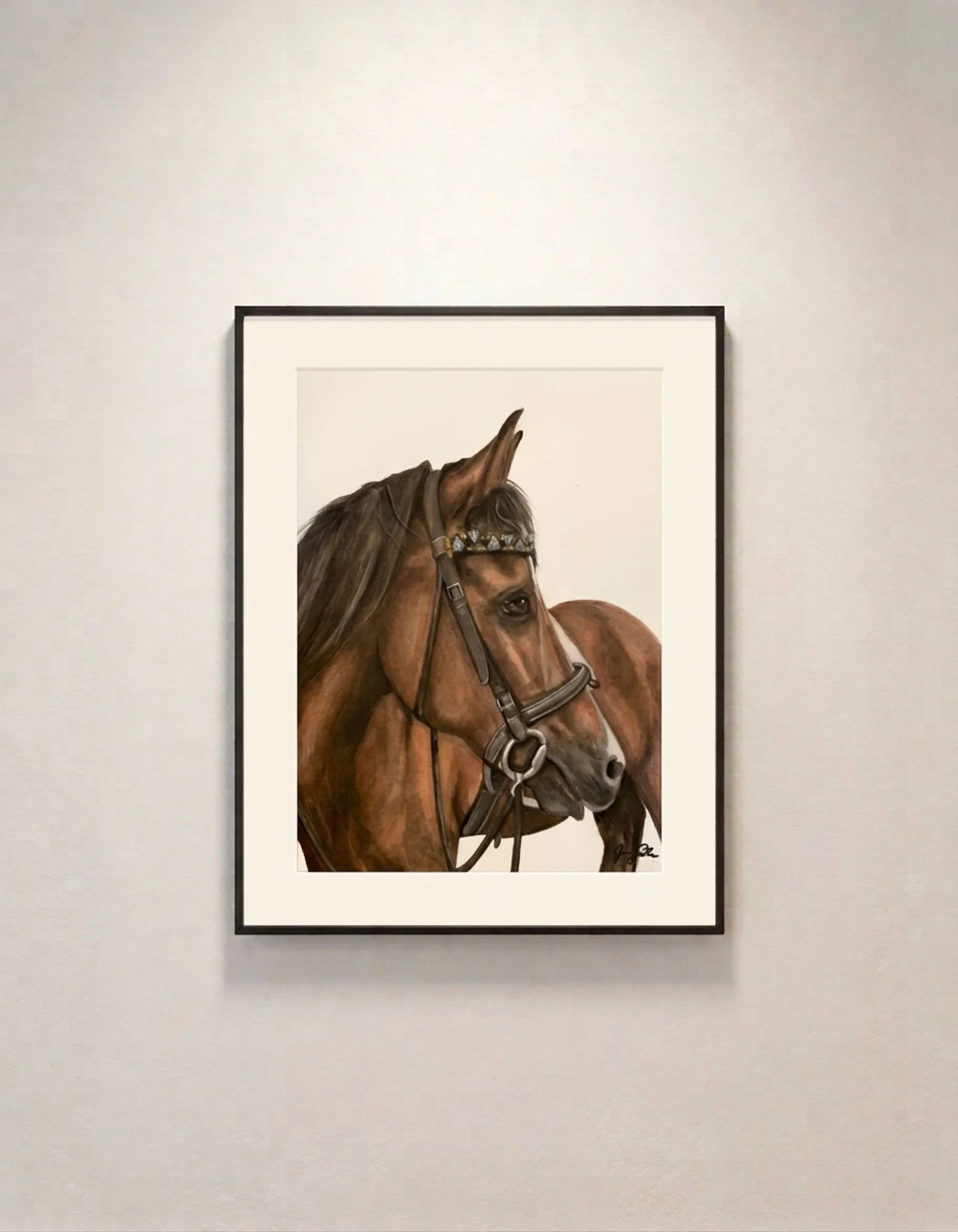 Framed watercolor and gouache painting of a brown horse wearing a bridle, framed and mounted on a white gallery wall.