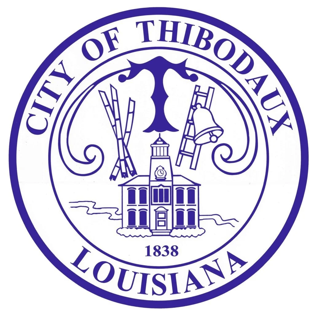 Seal of the city of Thibodaux, Louisiana, featuring a courthouse, barbed fishing net, ladder, bells, and marijuana leaves, with the year 1838.