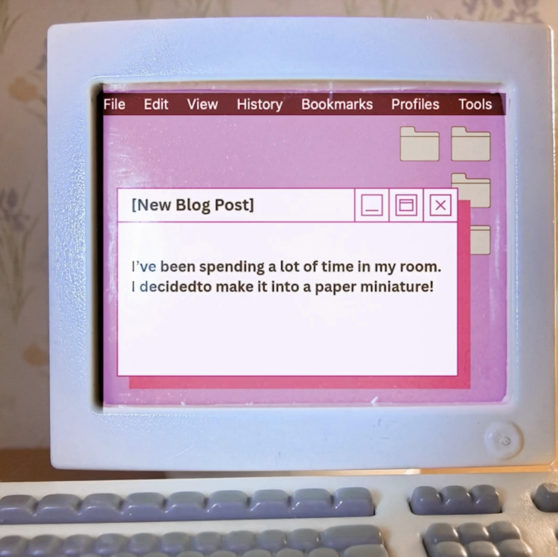 A vintage computer with a pink and purple screen, showing a blog post titled '[New Blog Post]' and a keyboard with rounded keys.