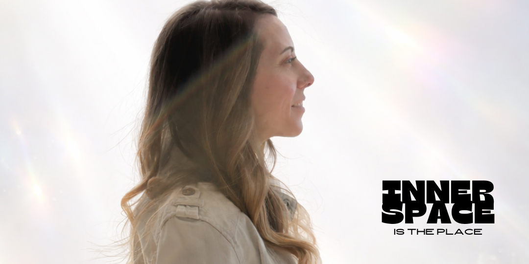 A woman with long brown hair smiling in profile against a bright background with lens flares, with the text 'FINDER SPACE IS THE PLACE' in bold black letters.