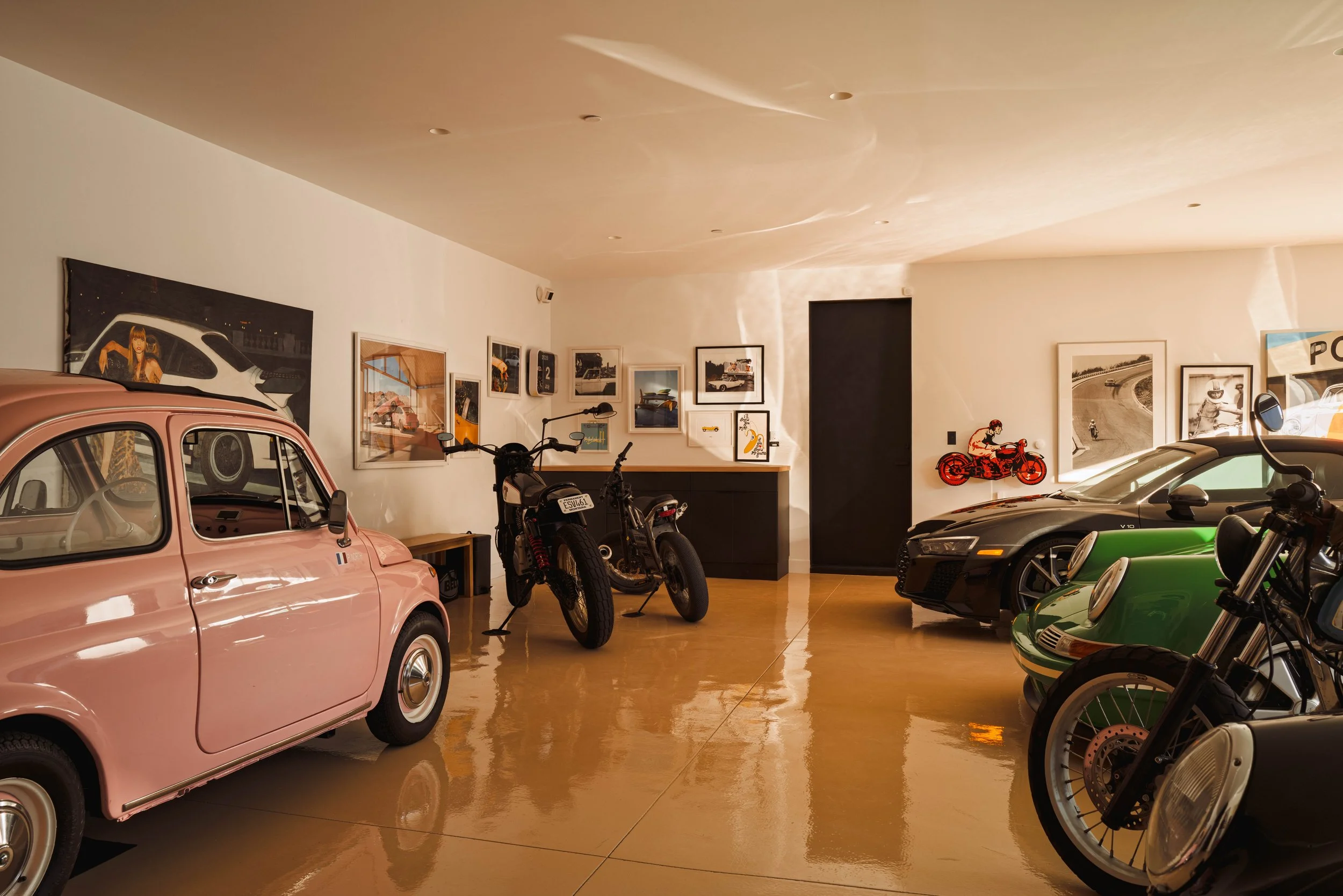 Car gallery garage with vintage cars and motorcycles, Malibu home interior photography