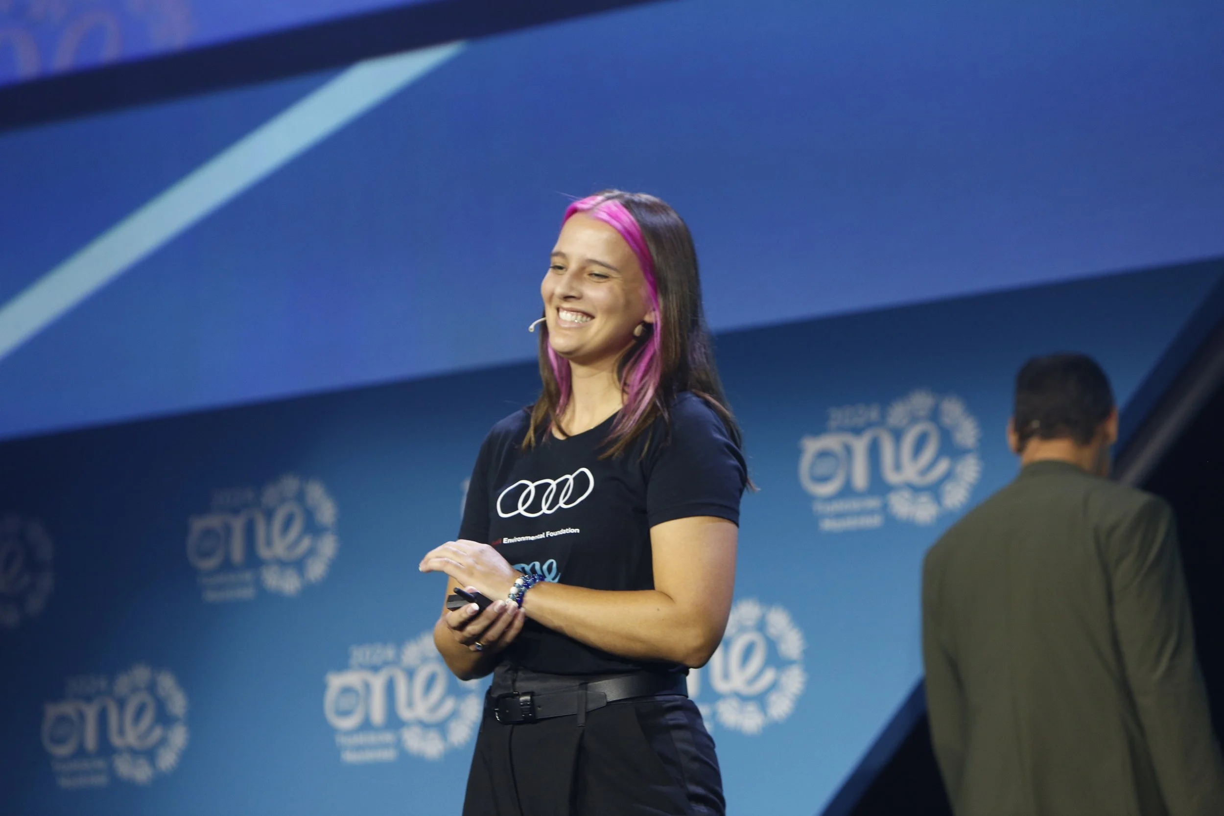 Franziska Trautmann, TED speaker and keynote speaker, speaking in front of an audience of young entrepreneurs and changemakers. Franziska Trautmann is an inspiring young speaker. Book Franziska for your event, conference, keynote, panel, college even