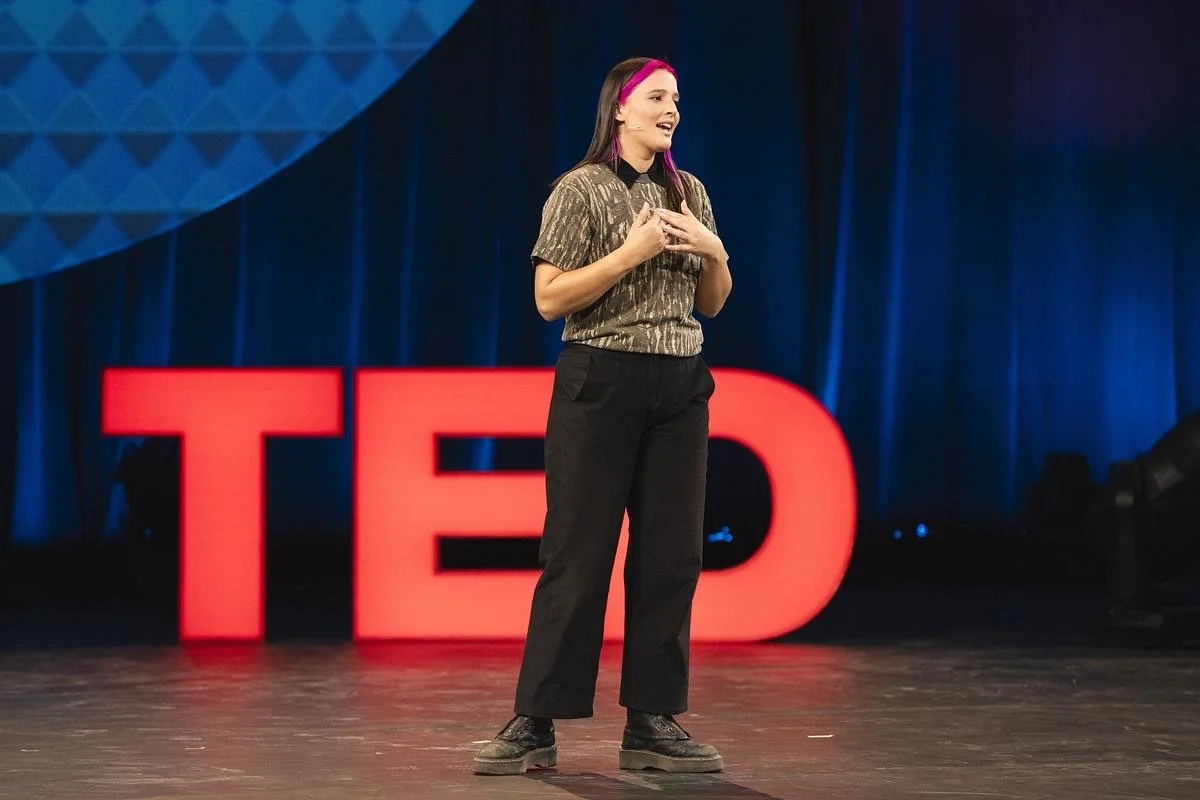 Franziska Trautmann aka "Glass Girl" giving her keynote Ted Talk on stage at Ted Next in Atlanta, Georgia. Franziska inspired the audience with her speech on her founder journey, building her startup Glass Half Full from the ground up.