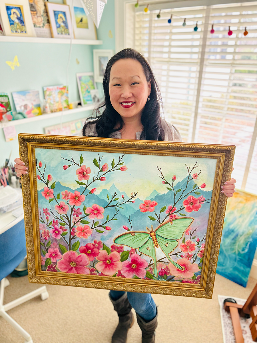 Kim Ellis with Mountain with Cherry Blossoms painting.png