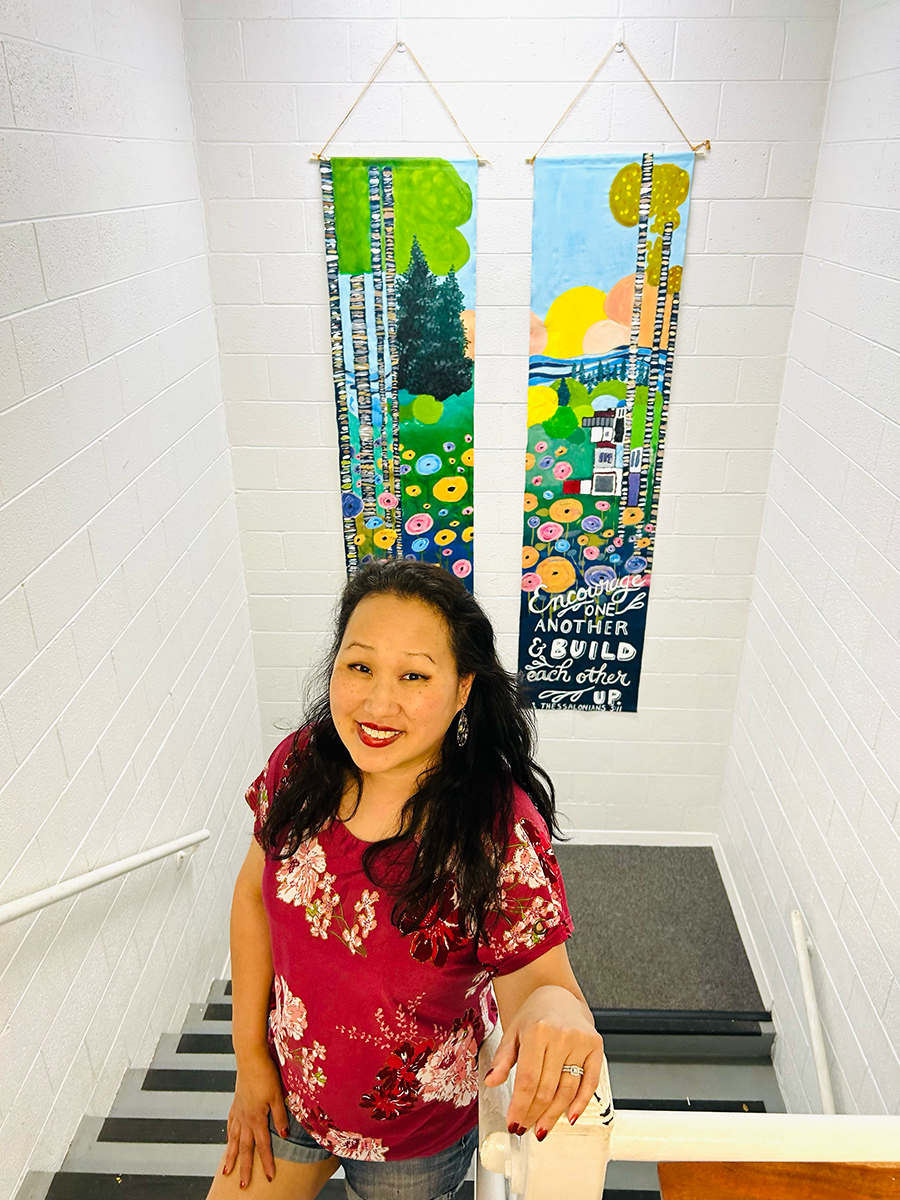 Kim Ellis with student created mural at PATHS school.png