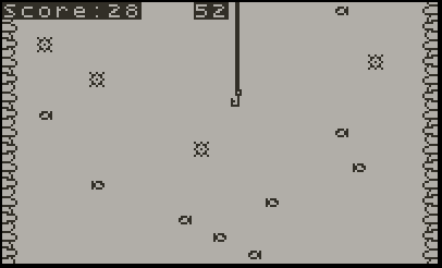 Older black-and-white video game screen showing a vertical line extending downward, with small shapes scattered across the screen.