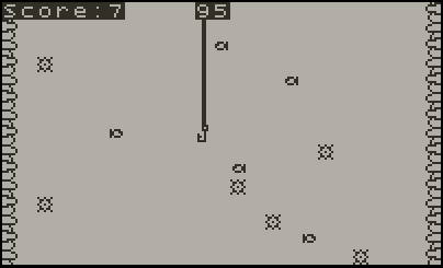 Screenshot of a vintage computer game with a gray background, score at 7, and a vertical line in the center with a small object hanging from it. Several objects are scattered across the screen, some enclosed in boxes, resembling a classic arcade game.