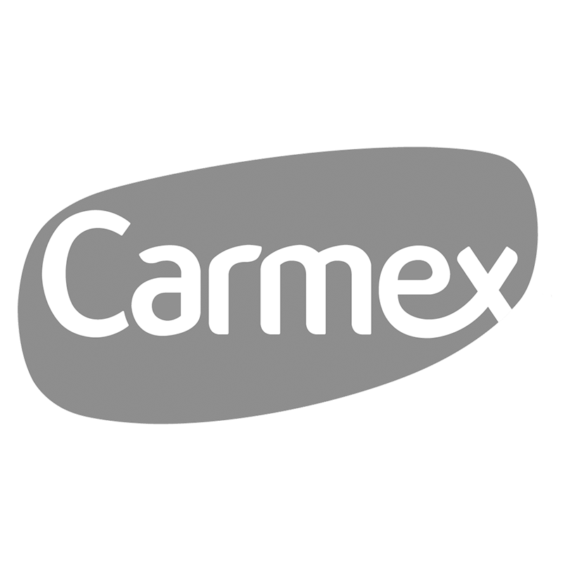Carmex logo with white text on an oval gray background.