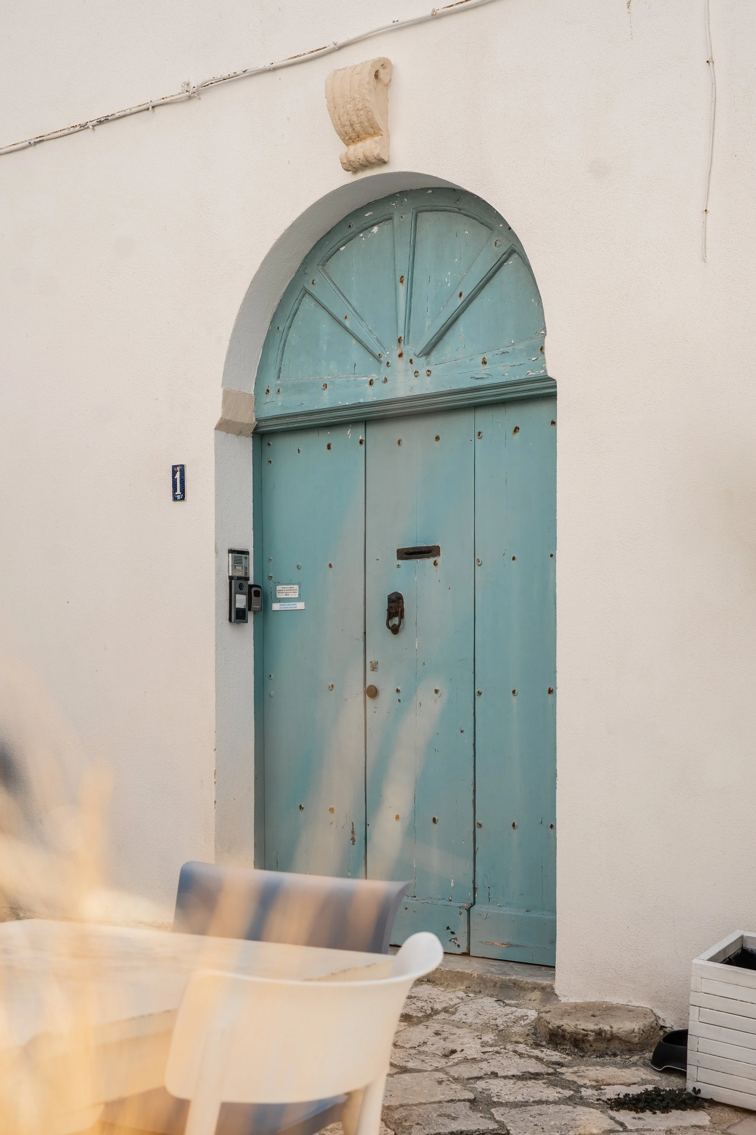 pastel-blue-arched-door-otranto-editorial-photographer.jpg