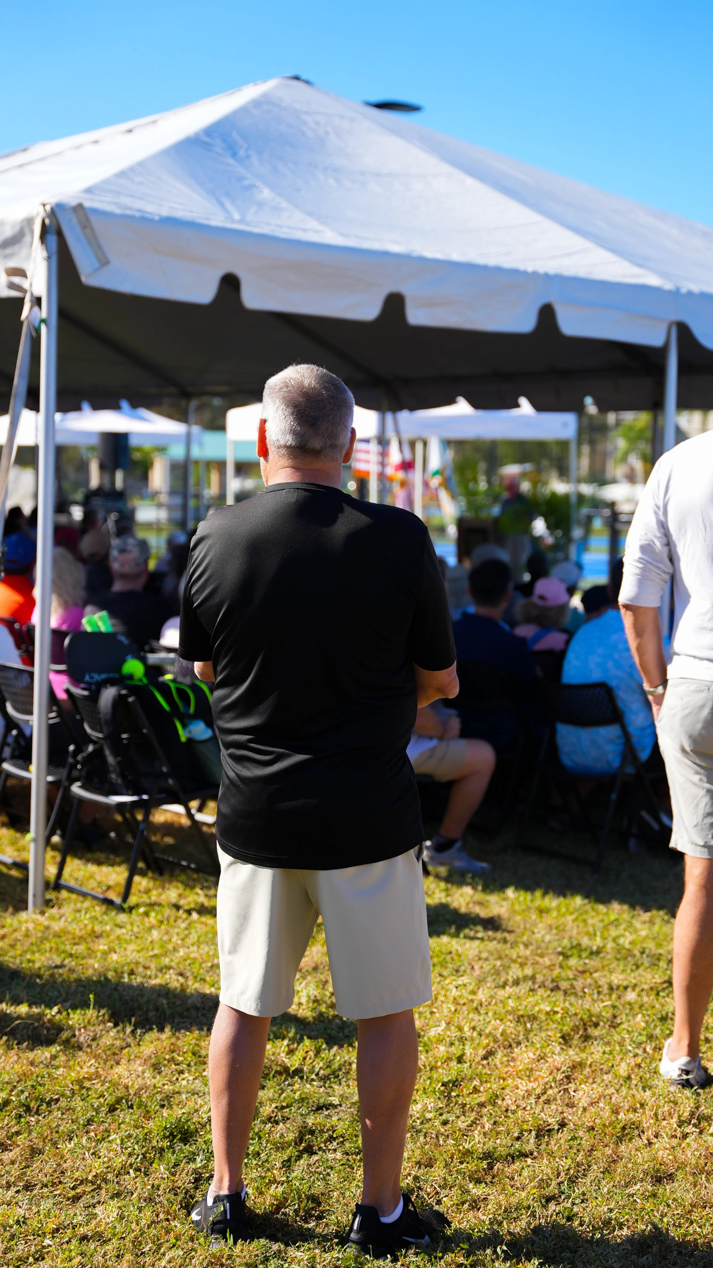 Chris Hoban stands watching one of the many community events he facilitated.