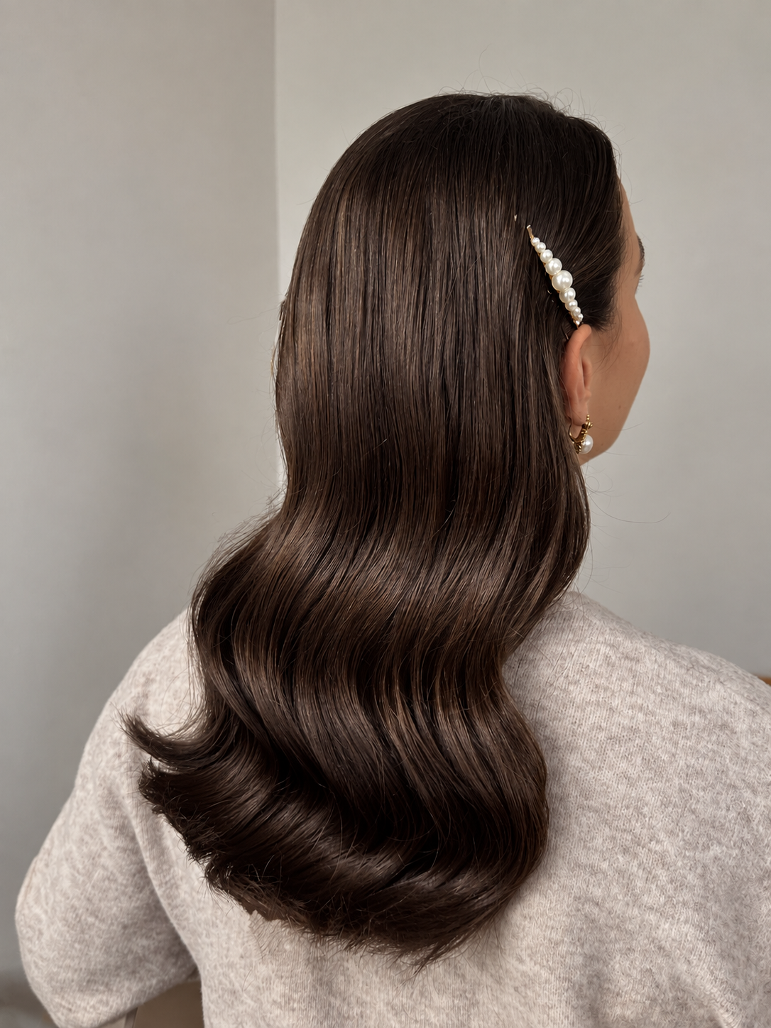 Pearl Barrette and Wavy Brunette Hair.png