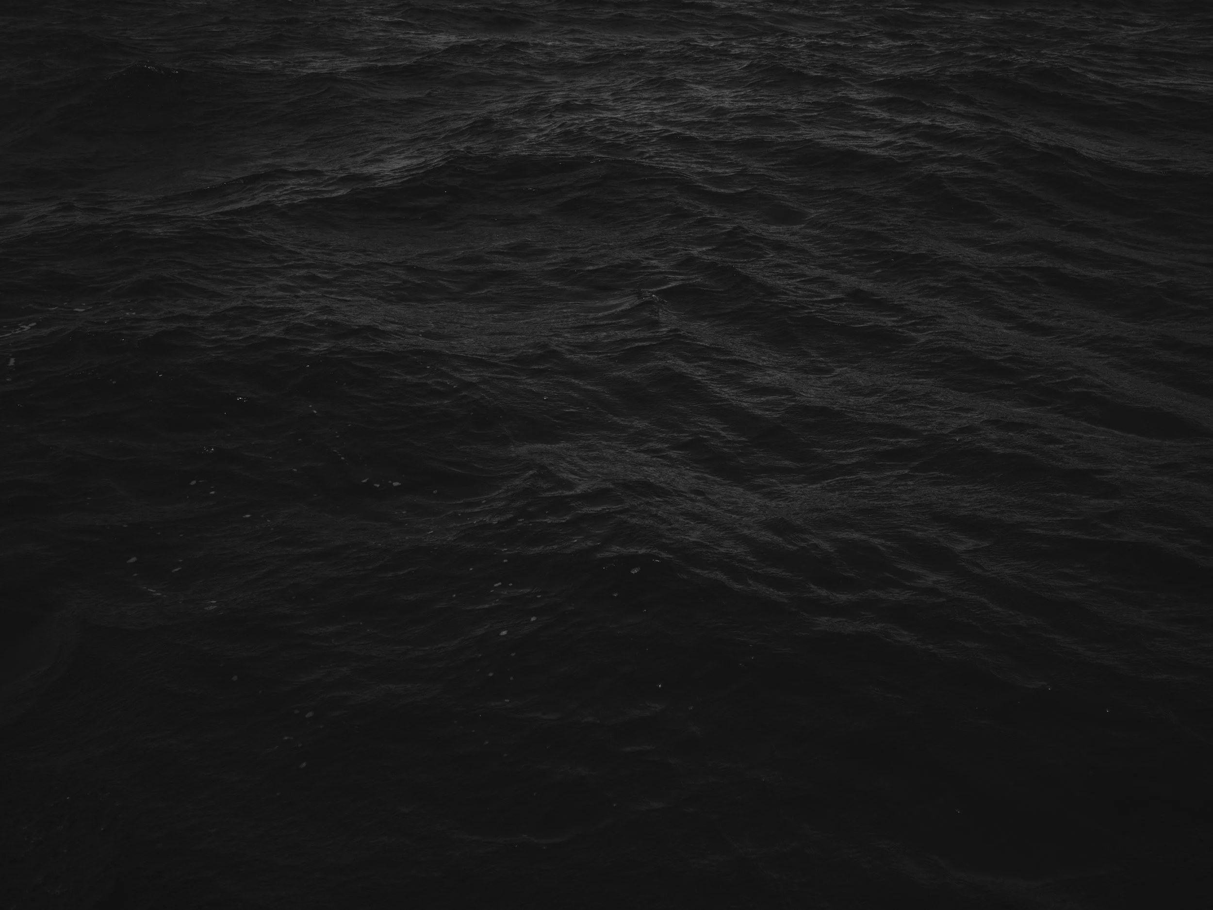 Dark, choppy ocean water with no visible objects or land.