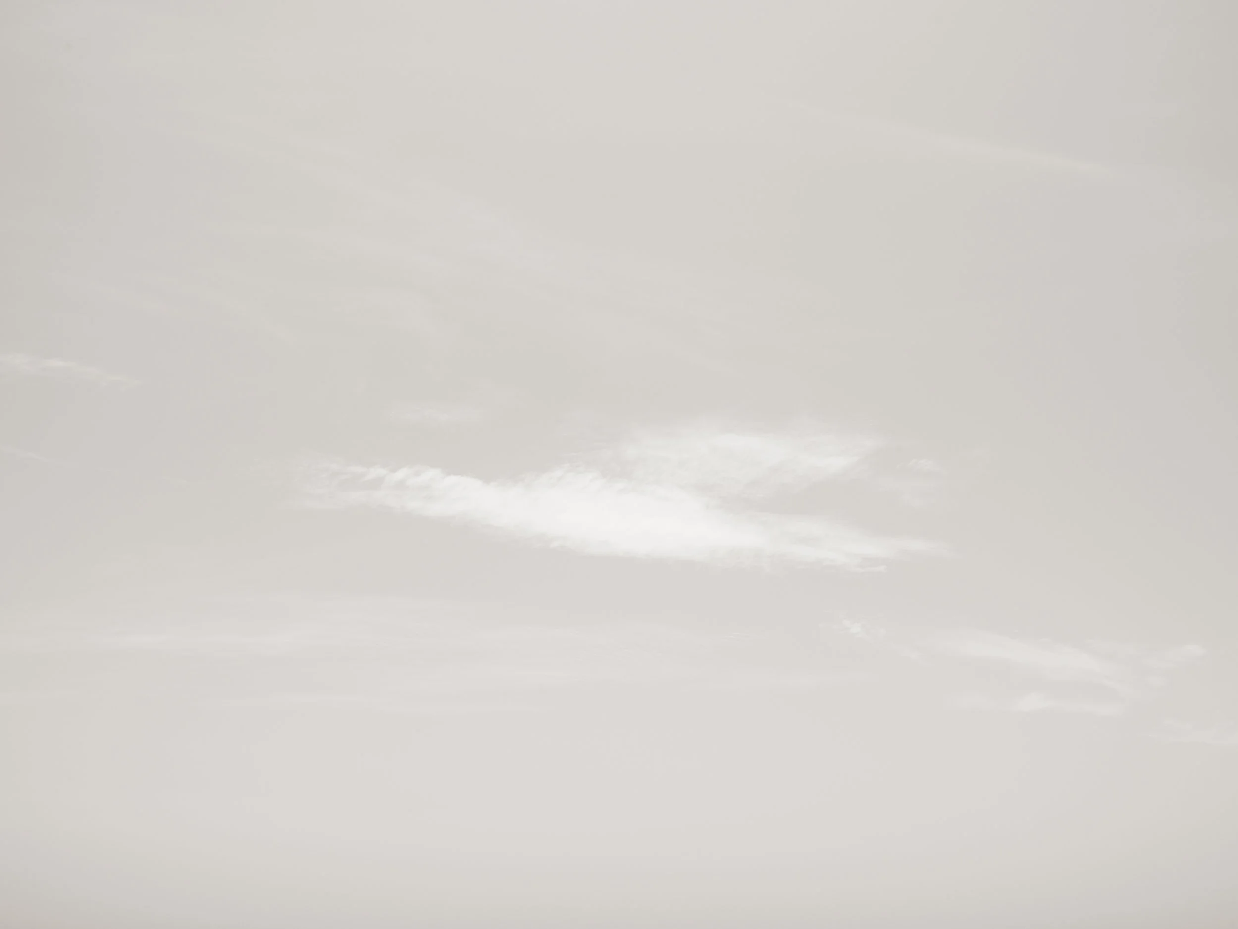 Gray, overcast sky with cloud cover.