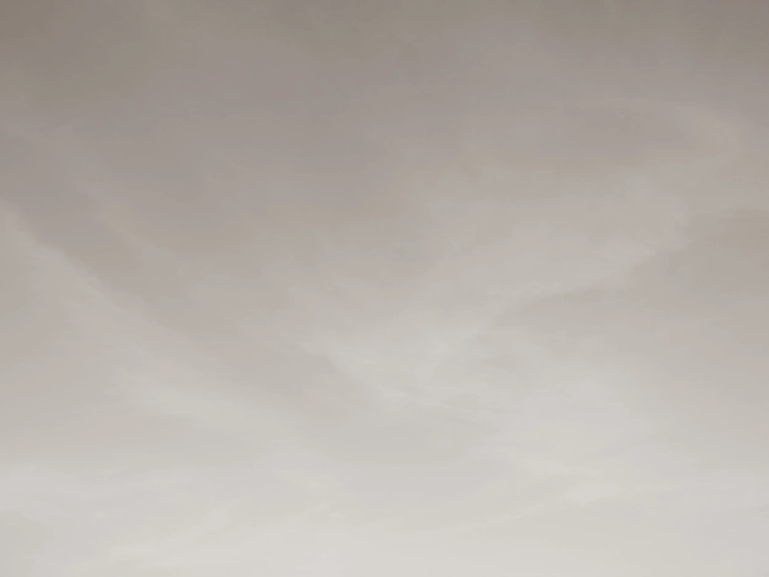 A view of a cloudy sky with shades of gray.