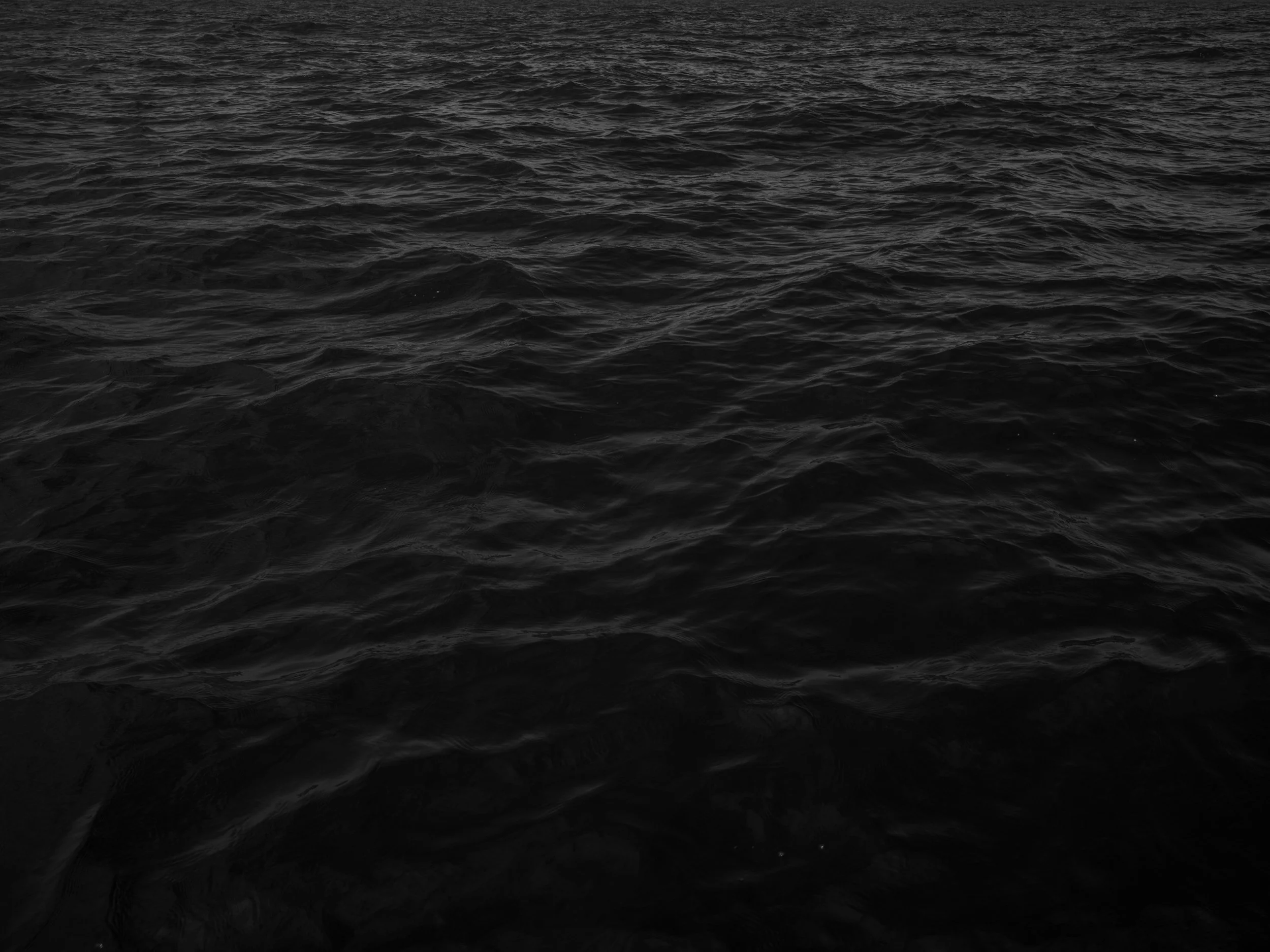Dark, choppy ocean water with no visible land or objects.