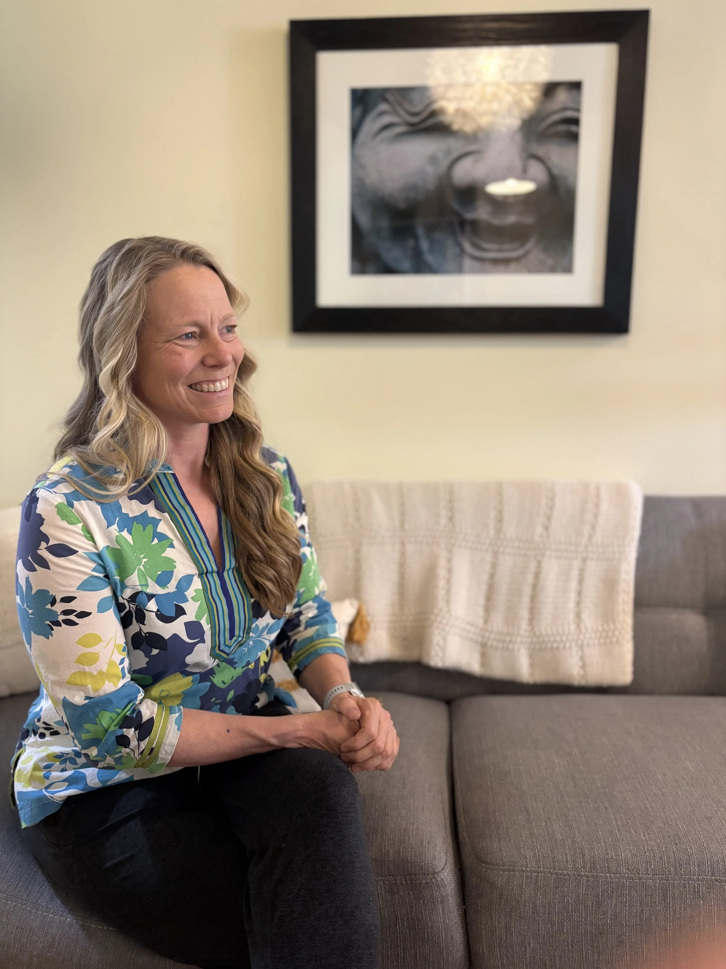 Polly Sackett smiling in her counseling office in Brookfield, Wisconsin