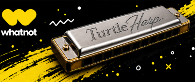 A metal harmonica labeled "Turtle Harp" on a black background with yellow and white decorative elements, and a yellow "whatnot" logo in the top left corner.
